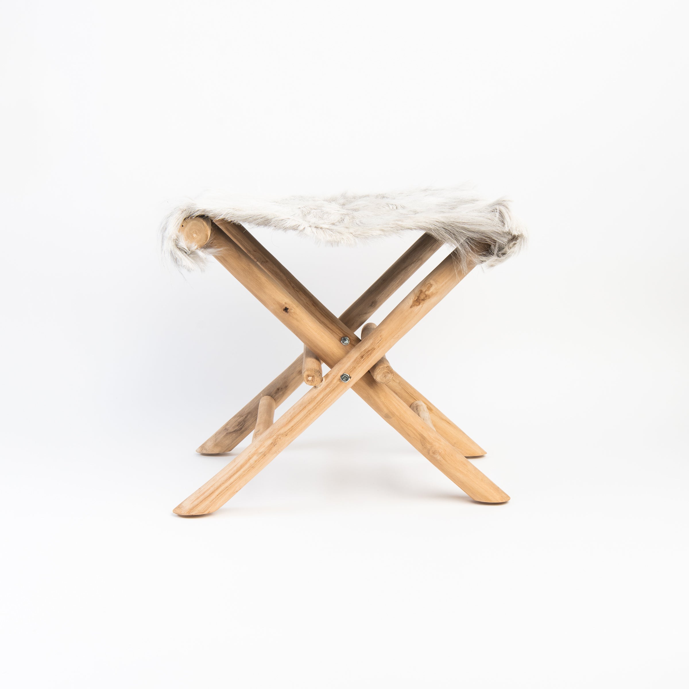 Teakwood and Goat Fur Folding Stool on a white background at Addison West