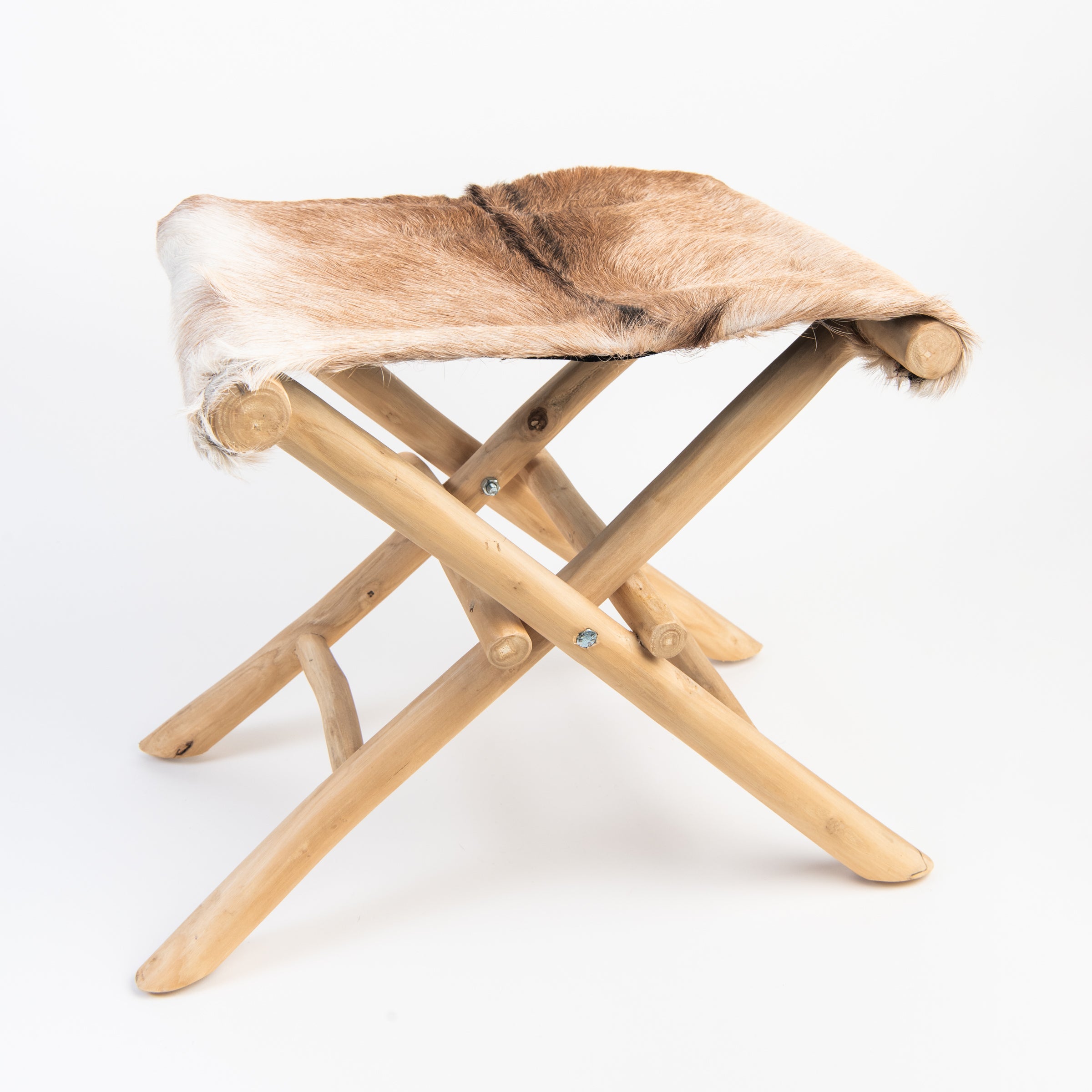 Teakwood and Goat Fur Folding Stool on a white background at Addison West