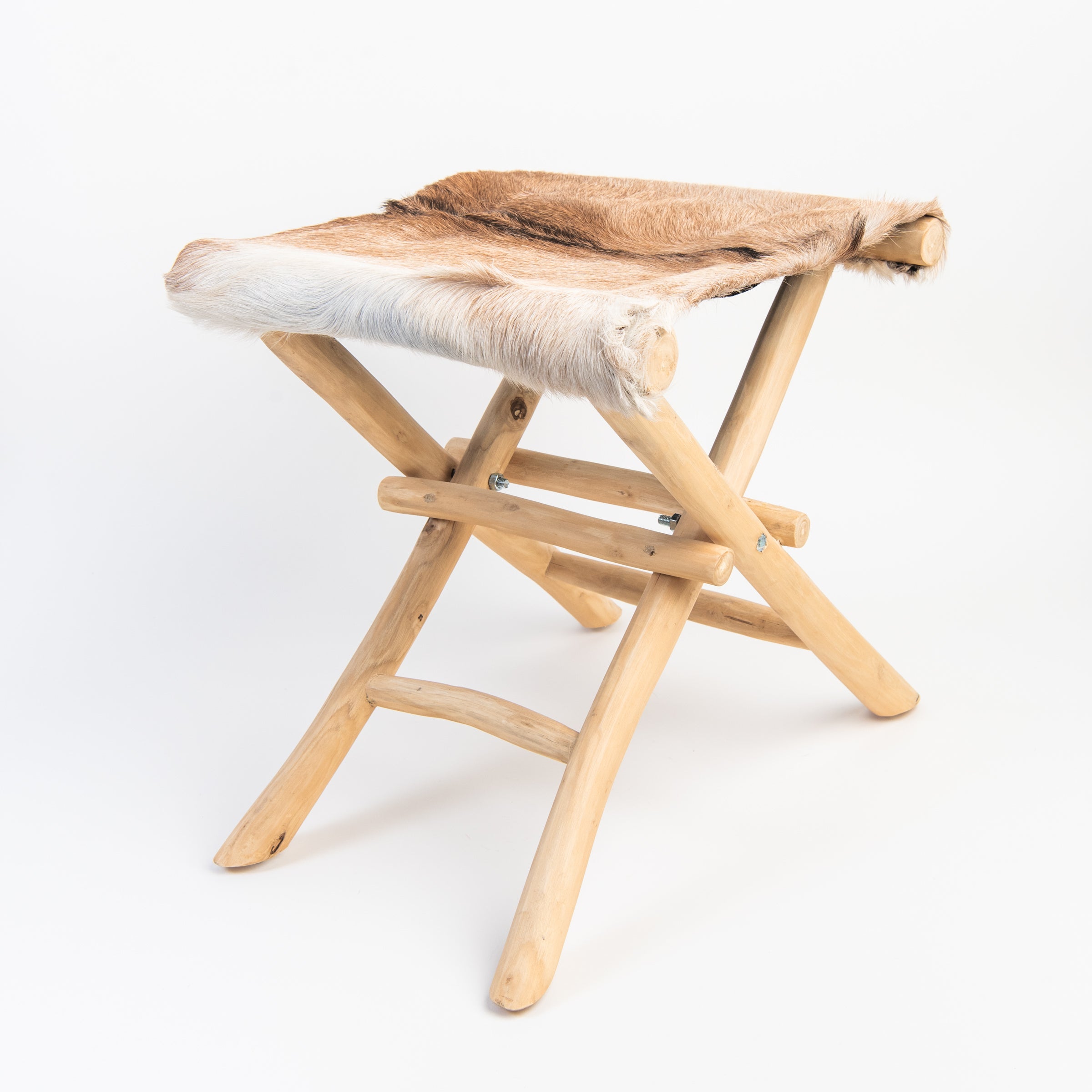 Teakwood and Goat Fur Folding Stool on a white background at Addison West