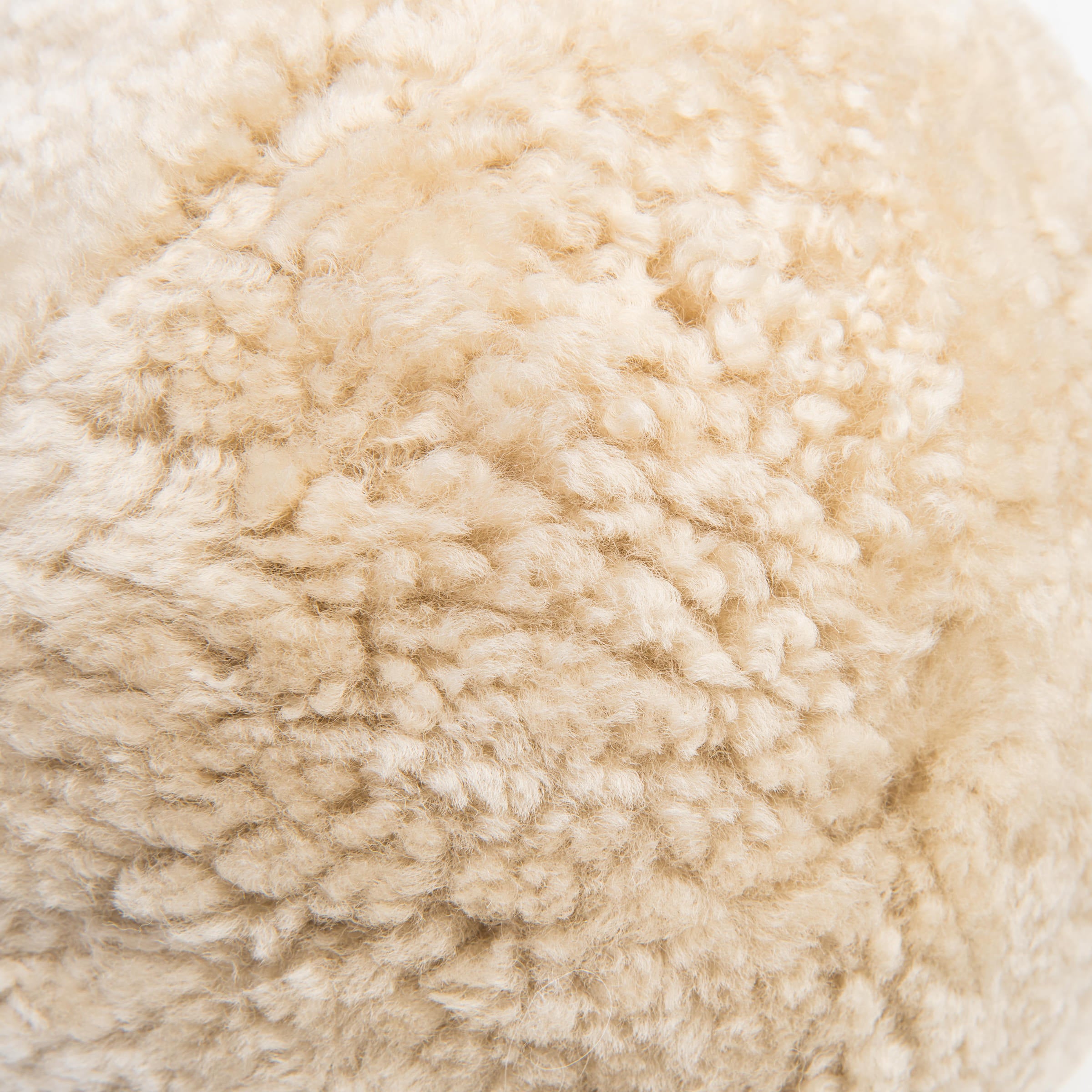 Close up of Sheepskin Ball Throw Pillow at Addison West