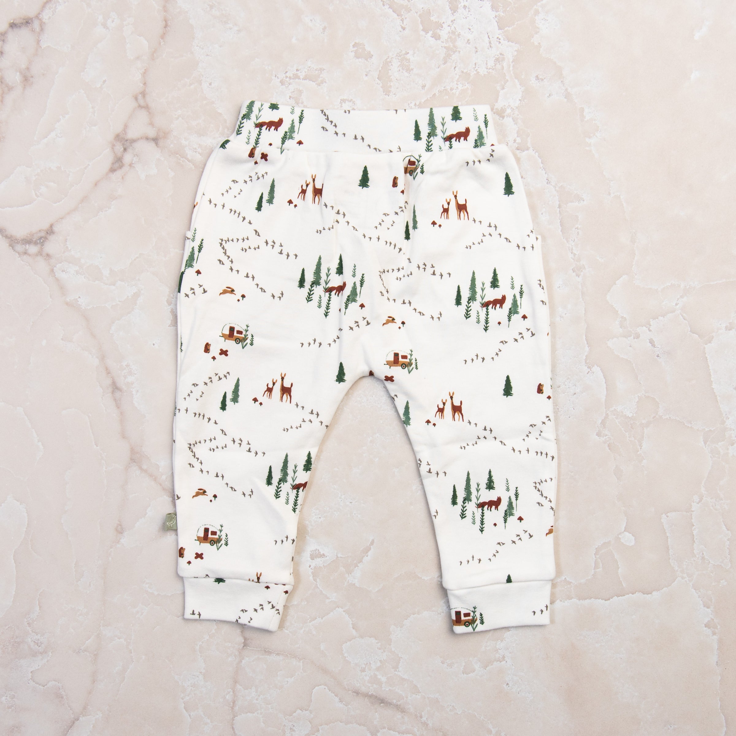 Into The Woods Organic Lounge Pants on a marble table at Addison West