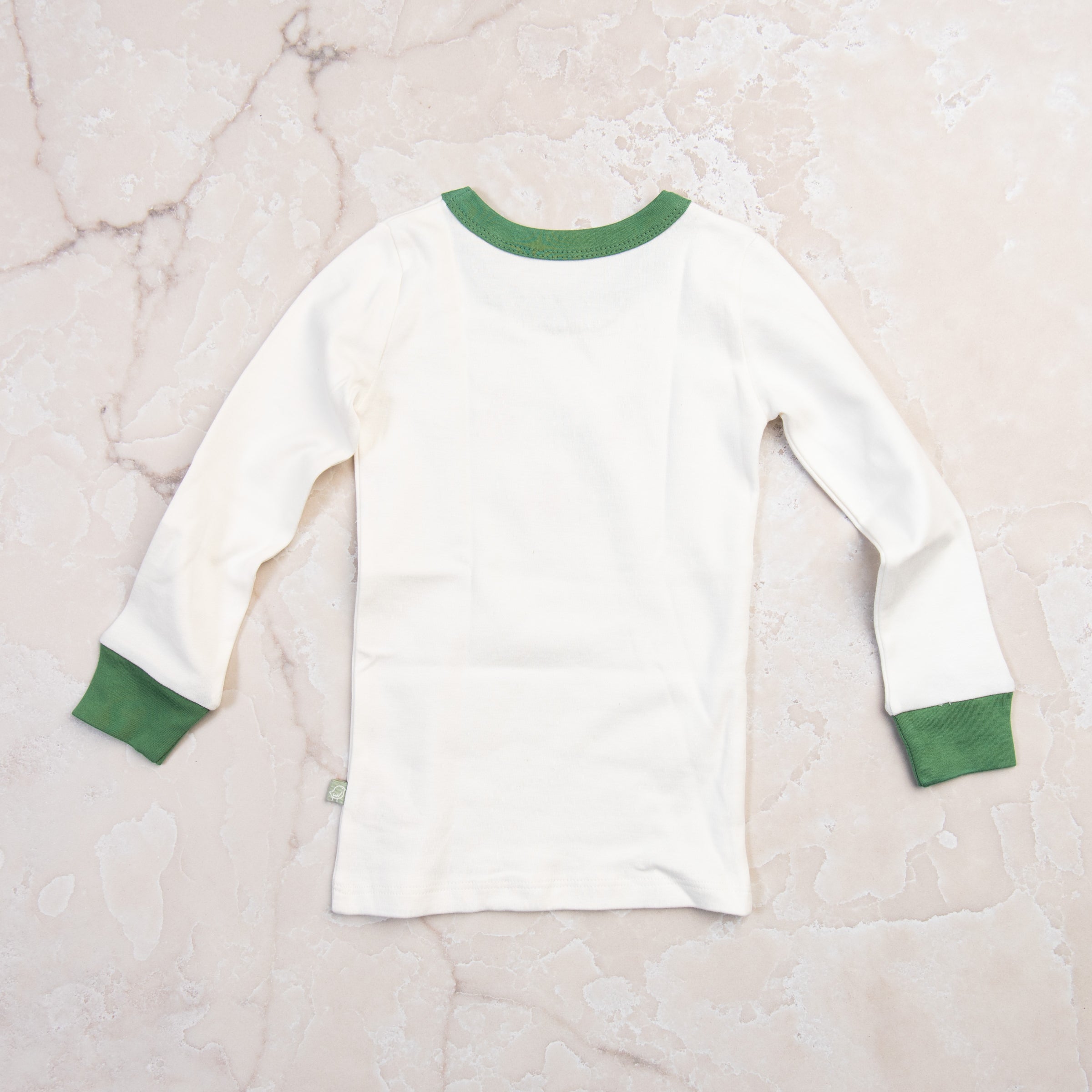 Apres Ski Organic Cotton Toddler PJs on a marble table at Addison West