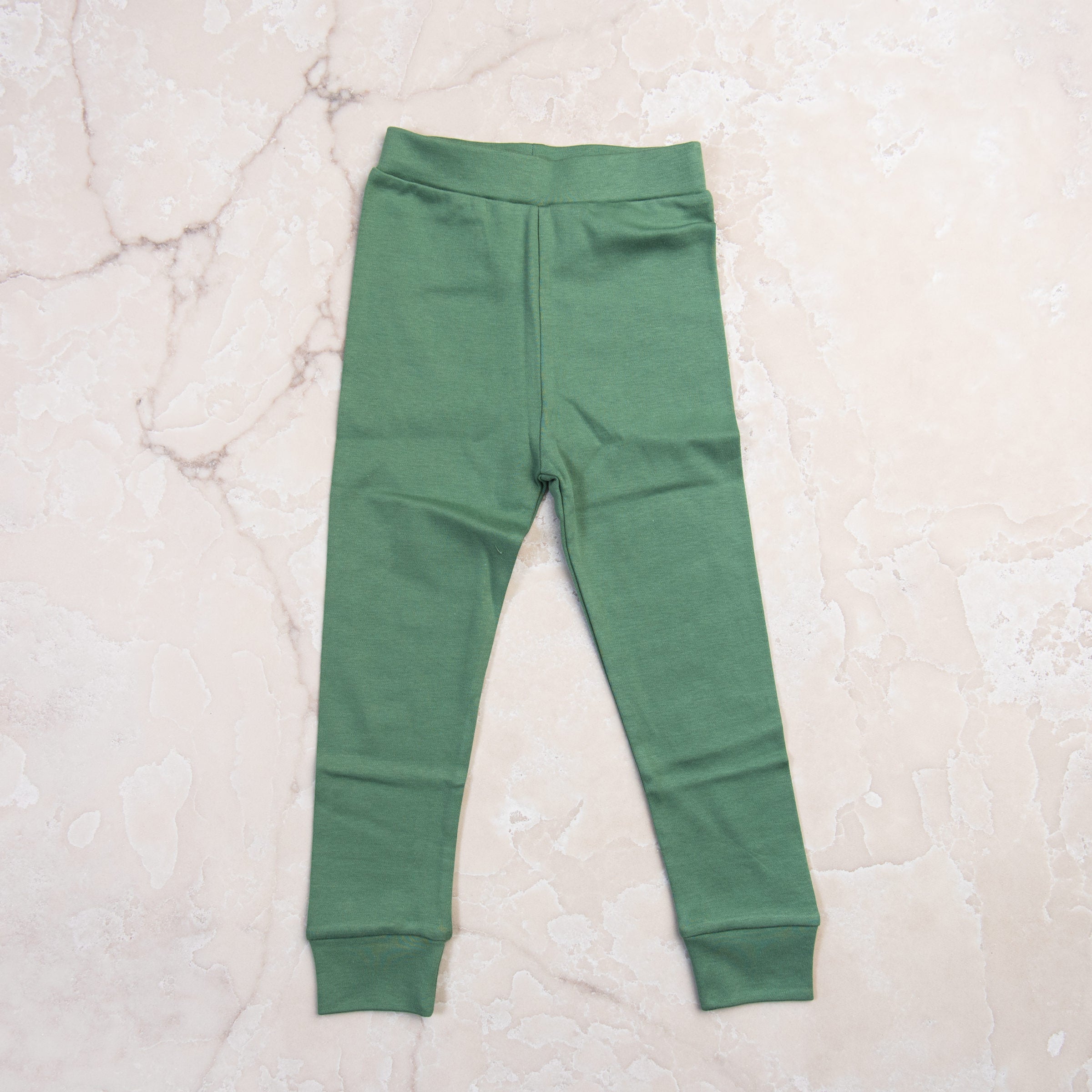 Apres Ski Organic Cotton Toddler PJs on a marble table at Addison West