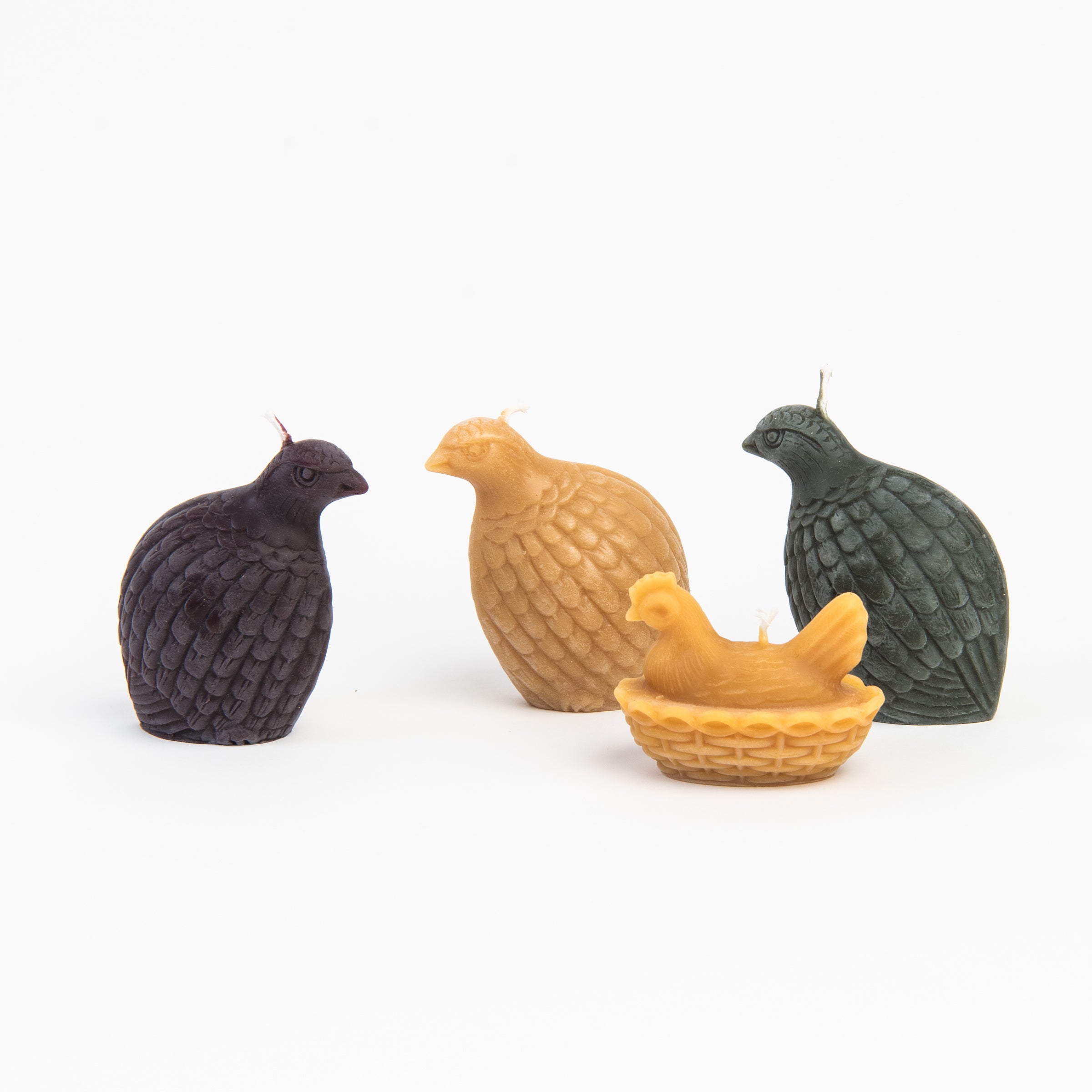 All natural beeswax sculptural candles on a white background at Addison West