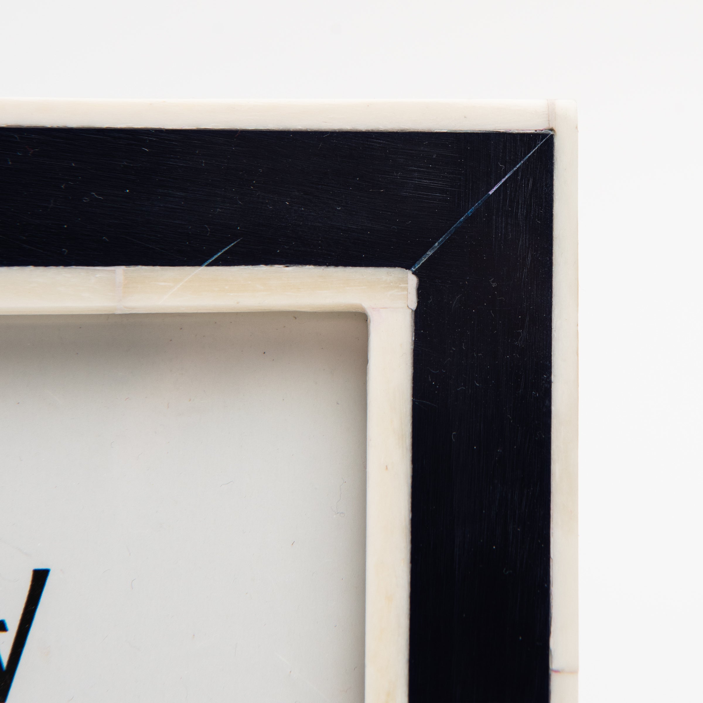 Close up of Classic Navy Frame on a white background at Addison West