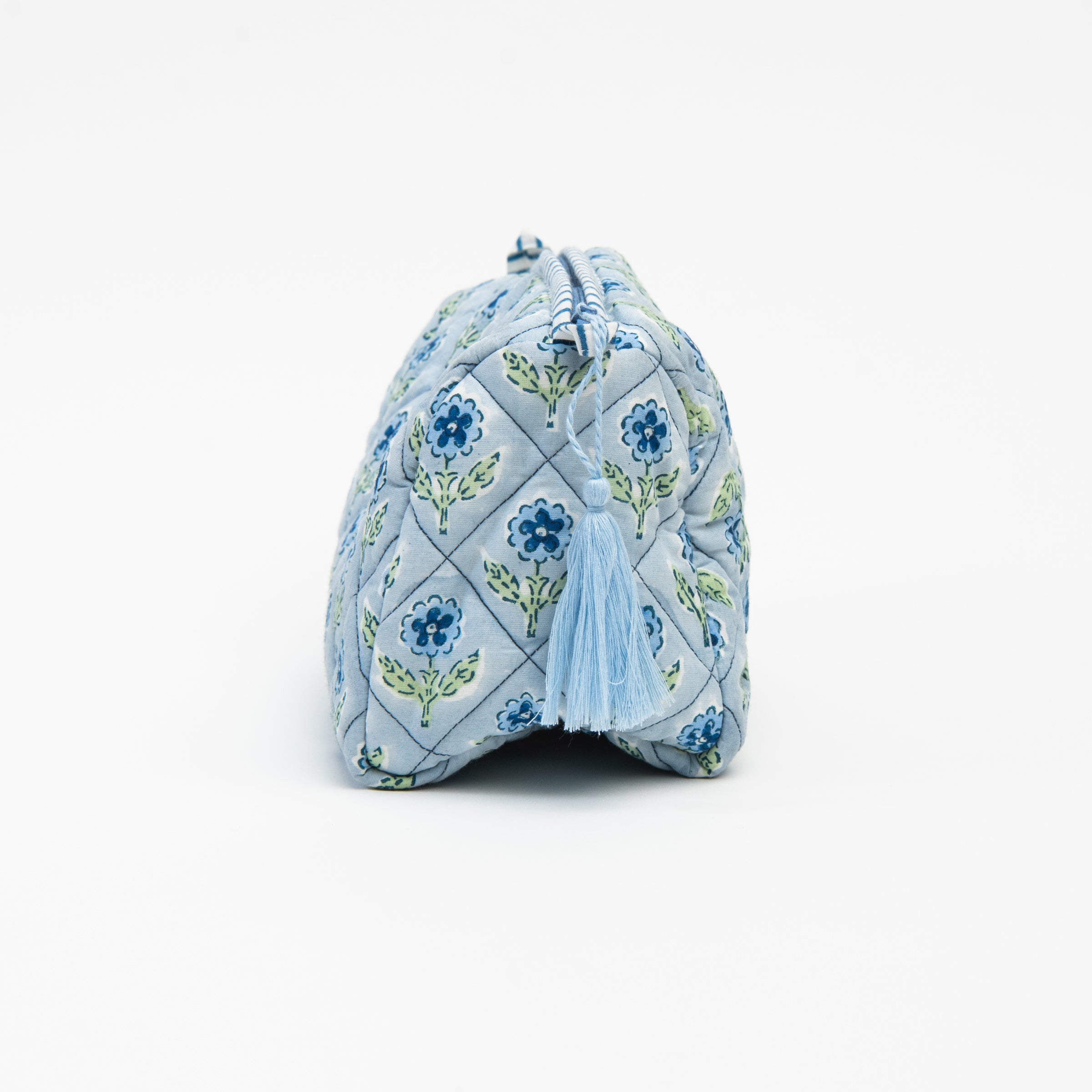 Side of Mona Print Toiletry Bag in Blue on a white background at Addison West