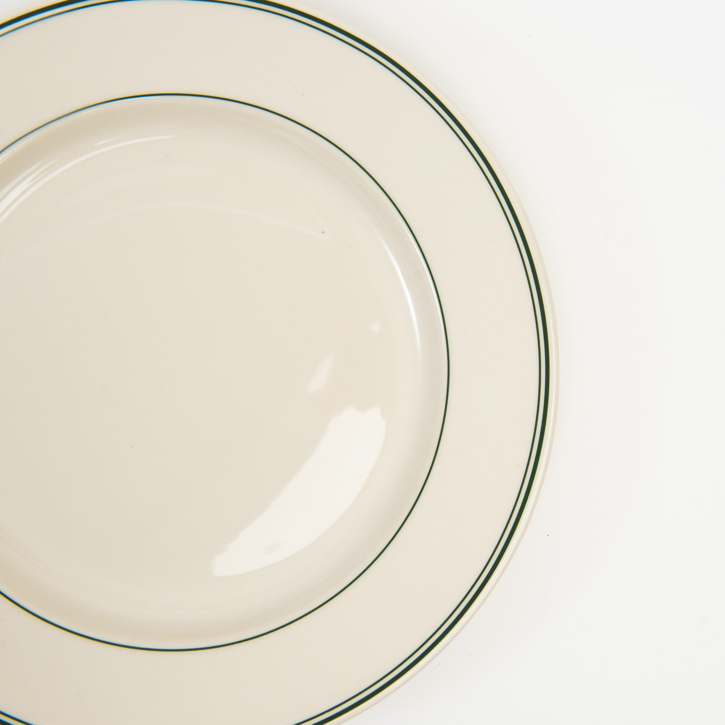 Close up of Fish's Eddy Greenband Main Plate on a white background at Addison West