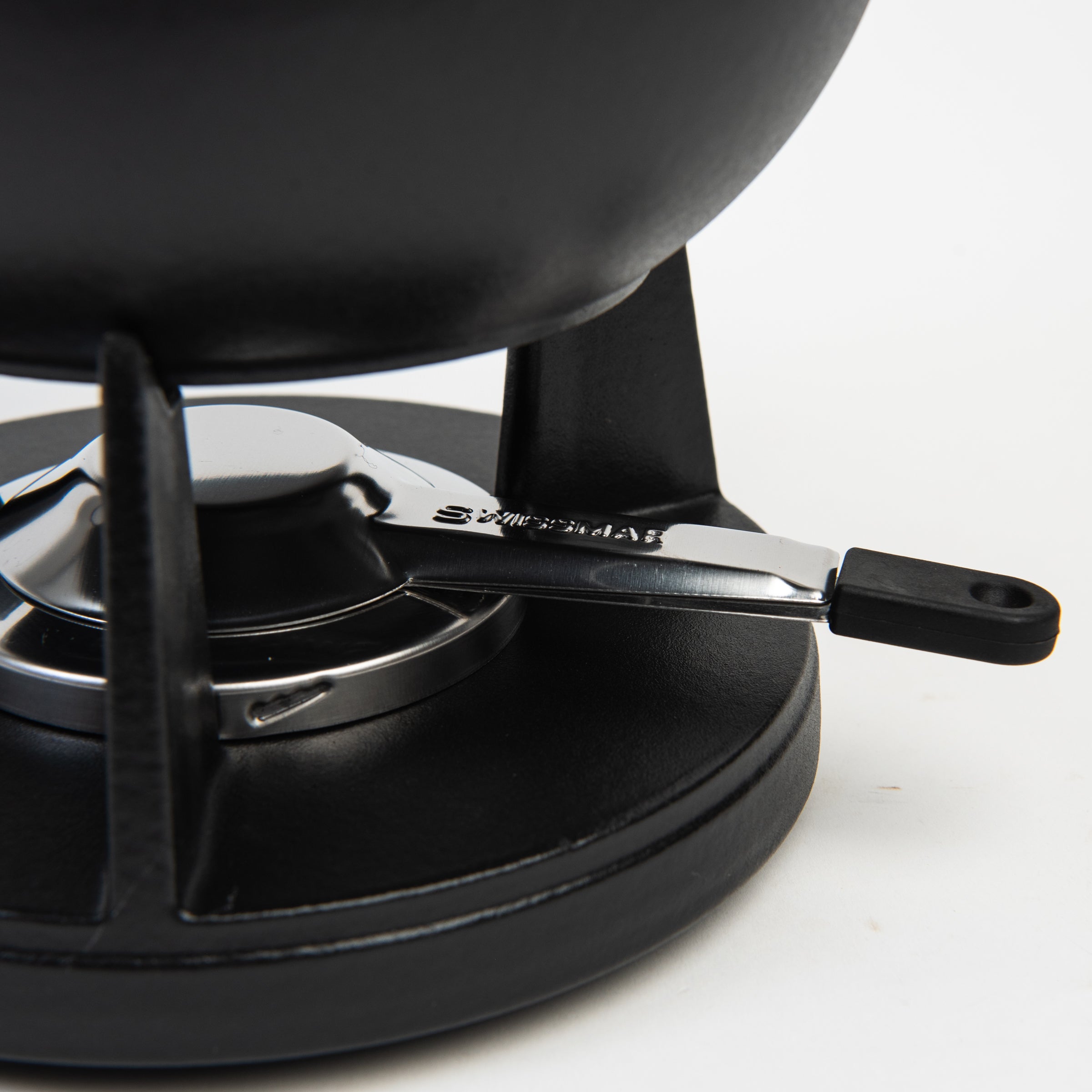 Close up of Swissmar Lucerne Cast Iron Fondue Set in Matte Black on a white background at Addison West