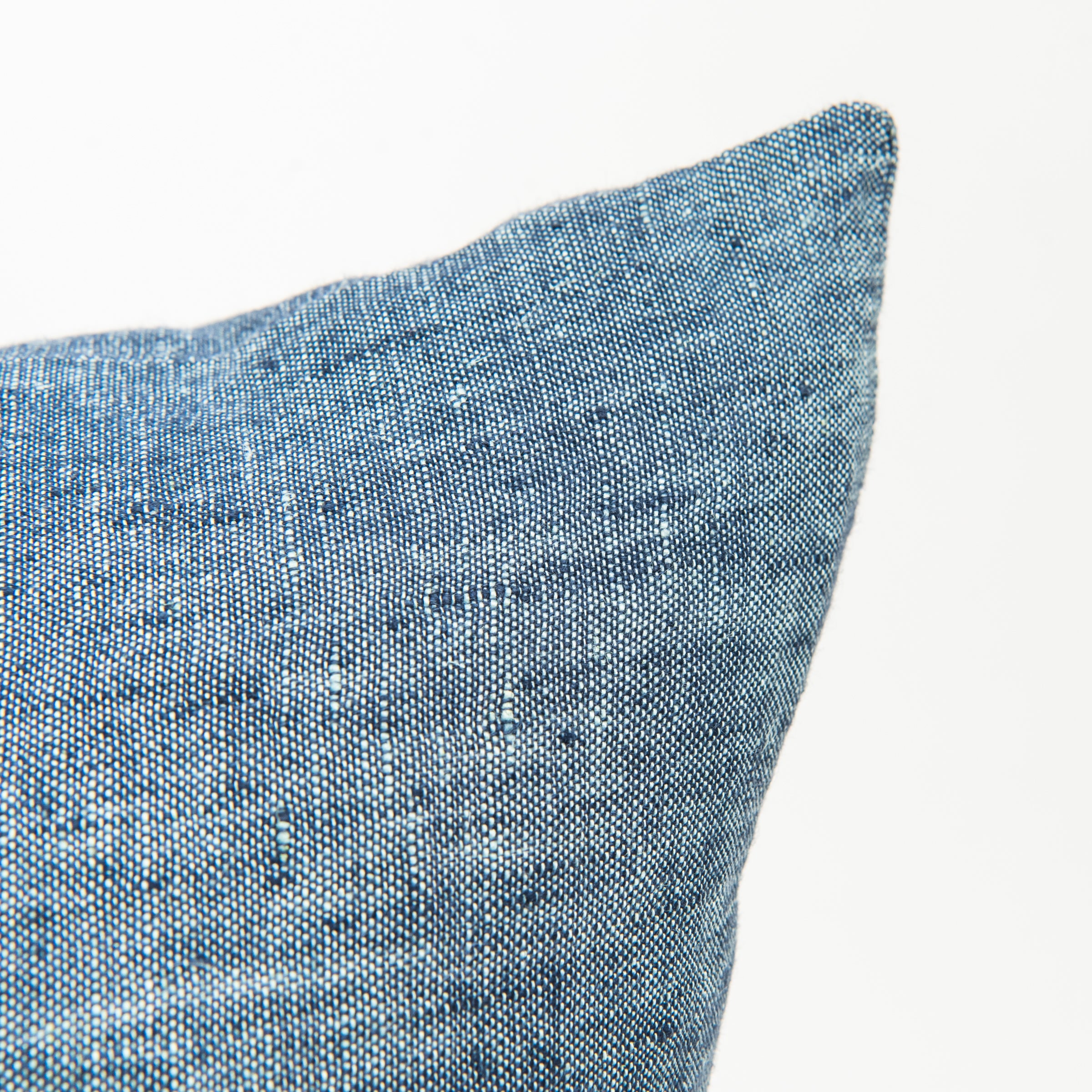 Close up of 20" Linen Chambray Pillow in Denim on a white background at Addison West