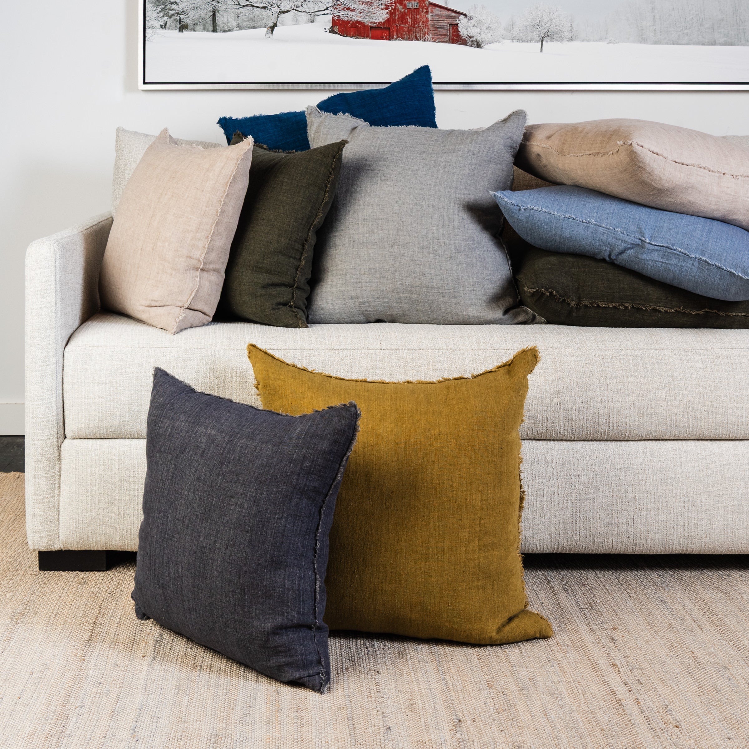 Lina Linen pillow collection on a sofa at Addison West