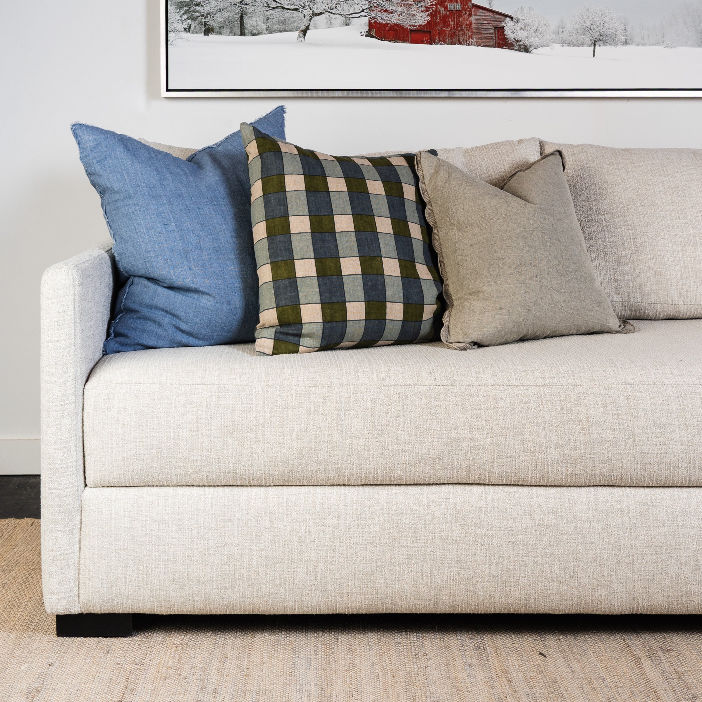 Ezra Earth Pillow on a sofa at Addison West