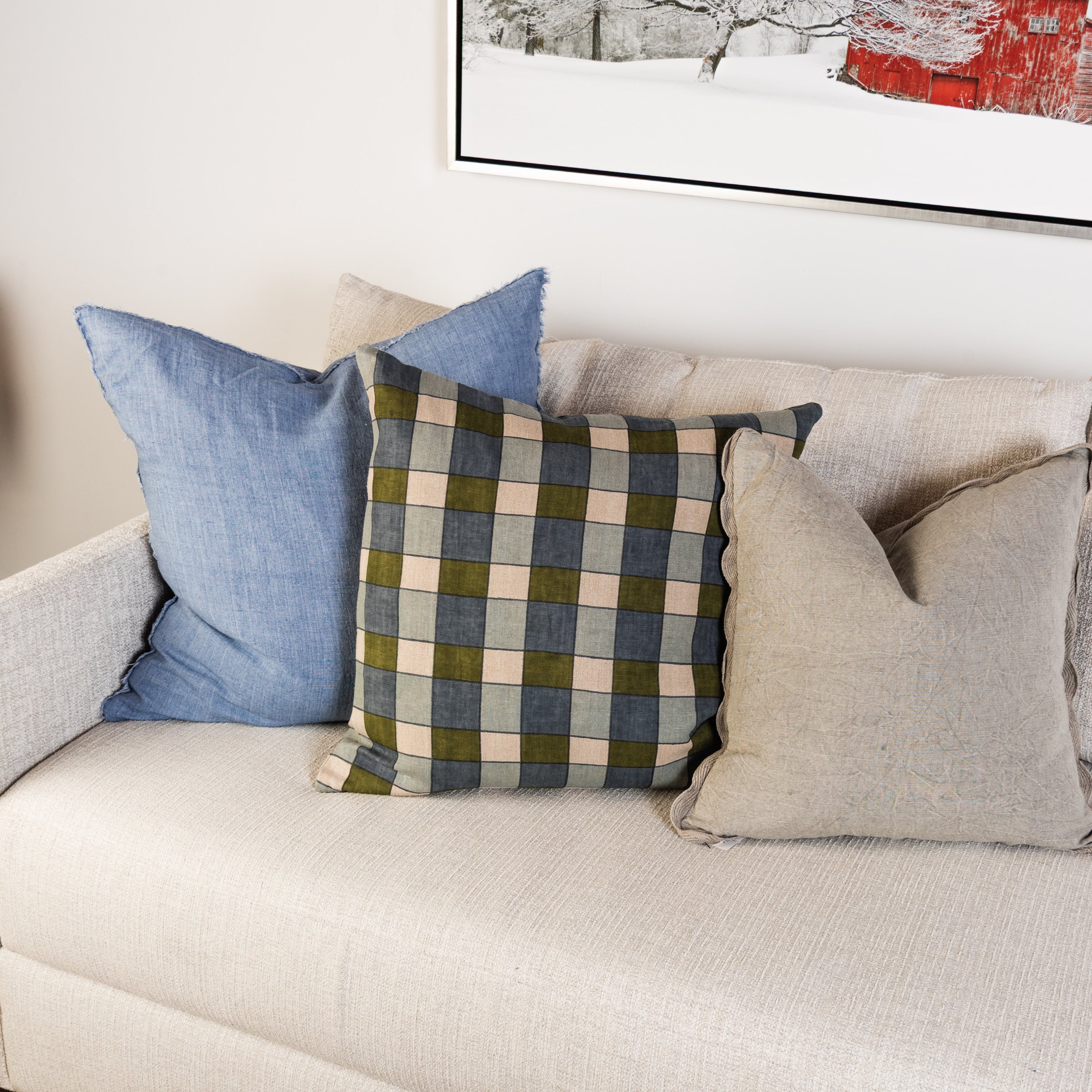 Ezra Earth Pillow on a sofa at Addison West