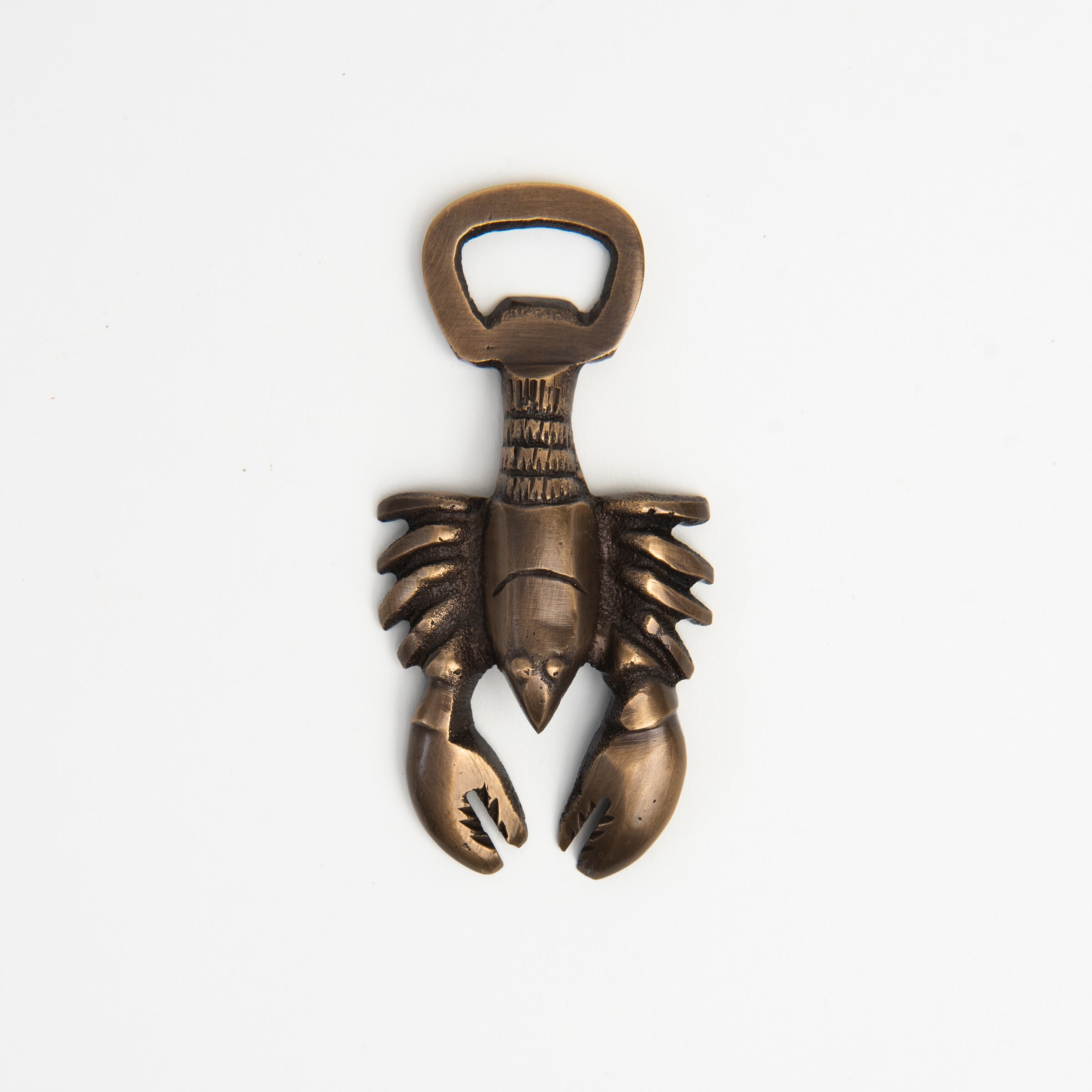 Antiqued Brass Lobster Bottle Opener on a white background at Addison West