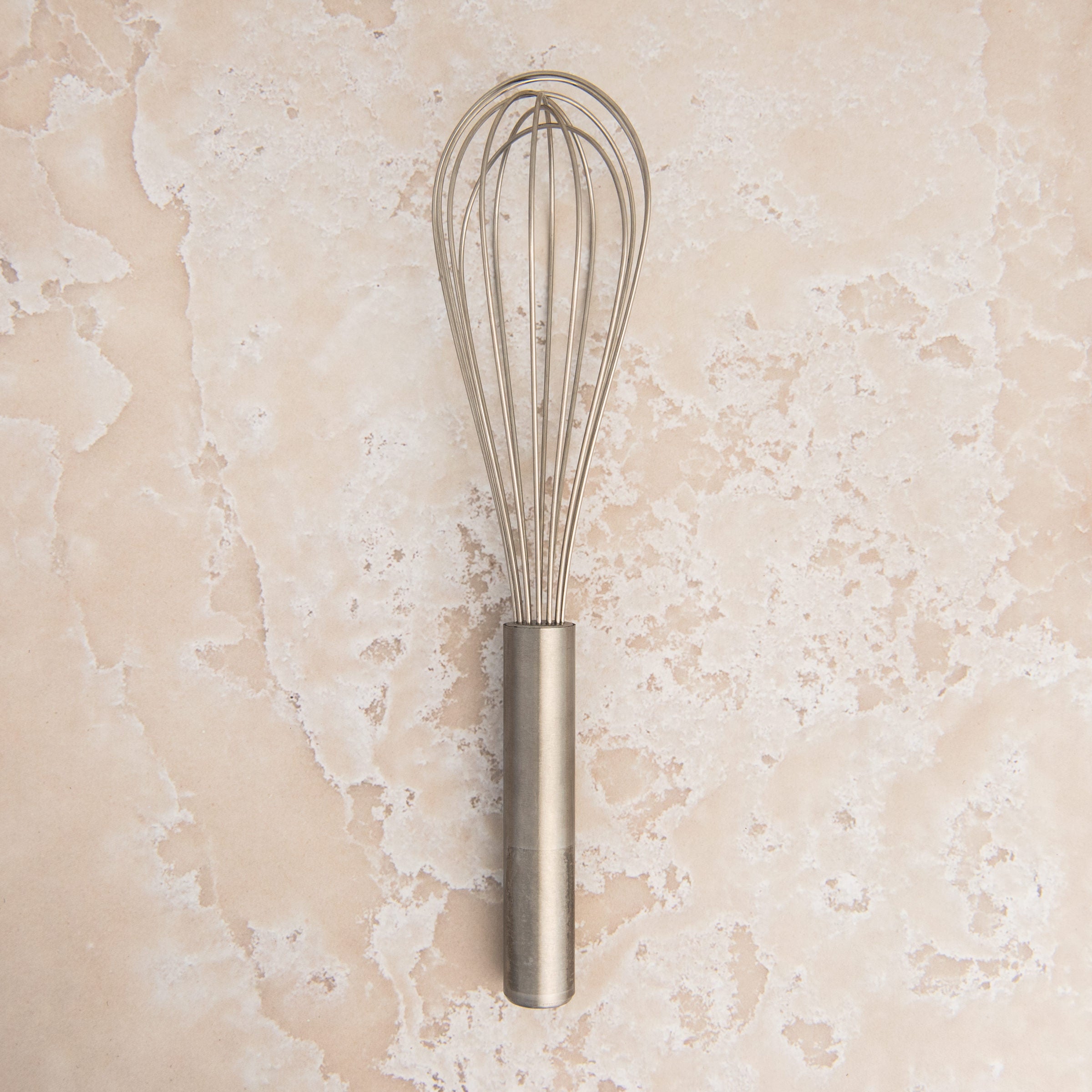 9.5 Inch Ballon Whisk on a beige background at Addison West