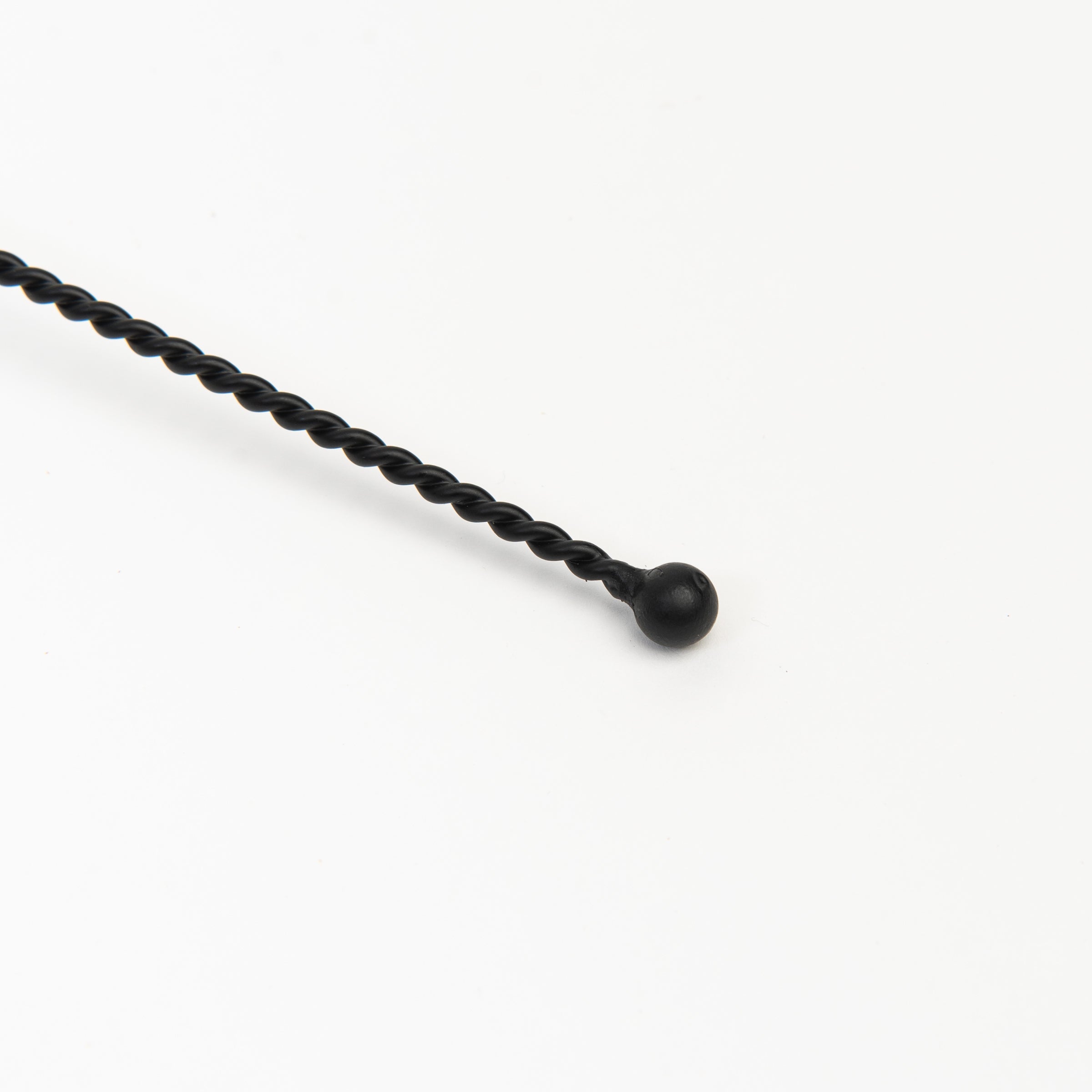 Black metal Candle Snuffer on a white background at Addison West