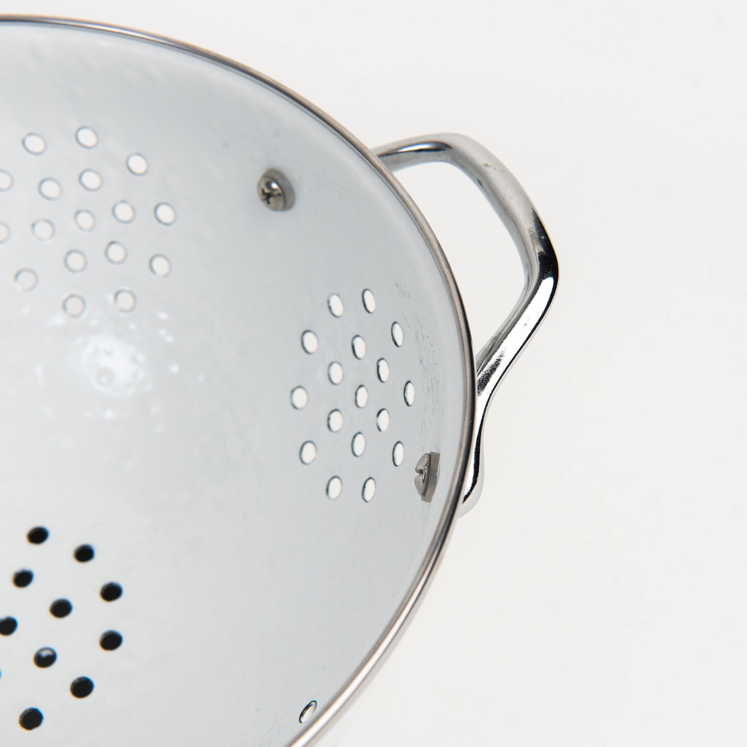 Large White Enamelware Colander on a white background at Addison West