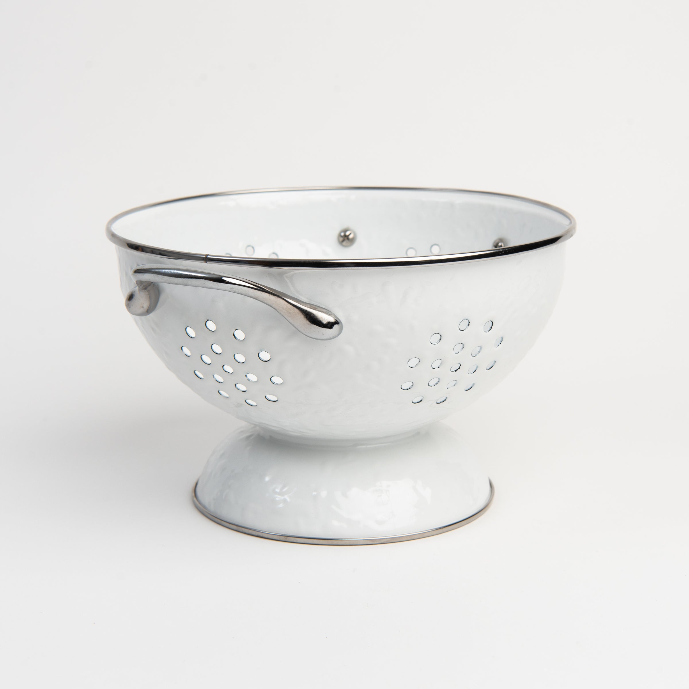 Medium White Enamelware Colander on a white background at Addison West