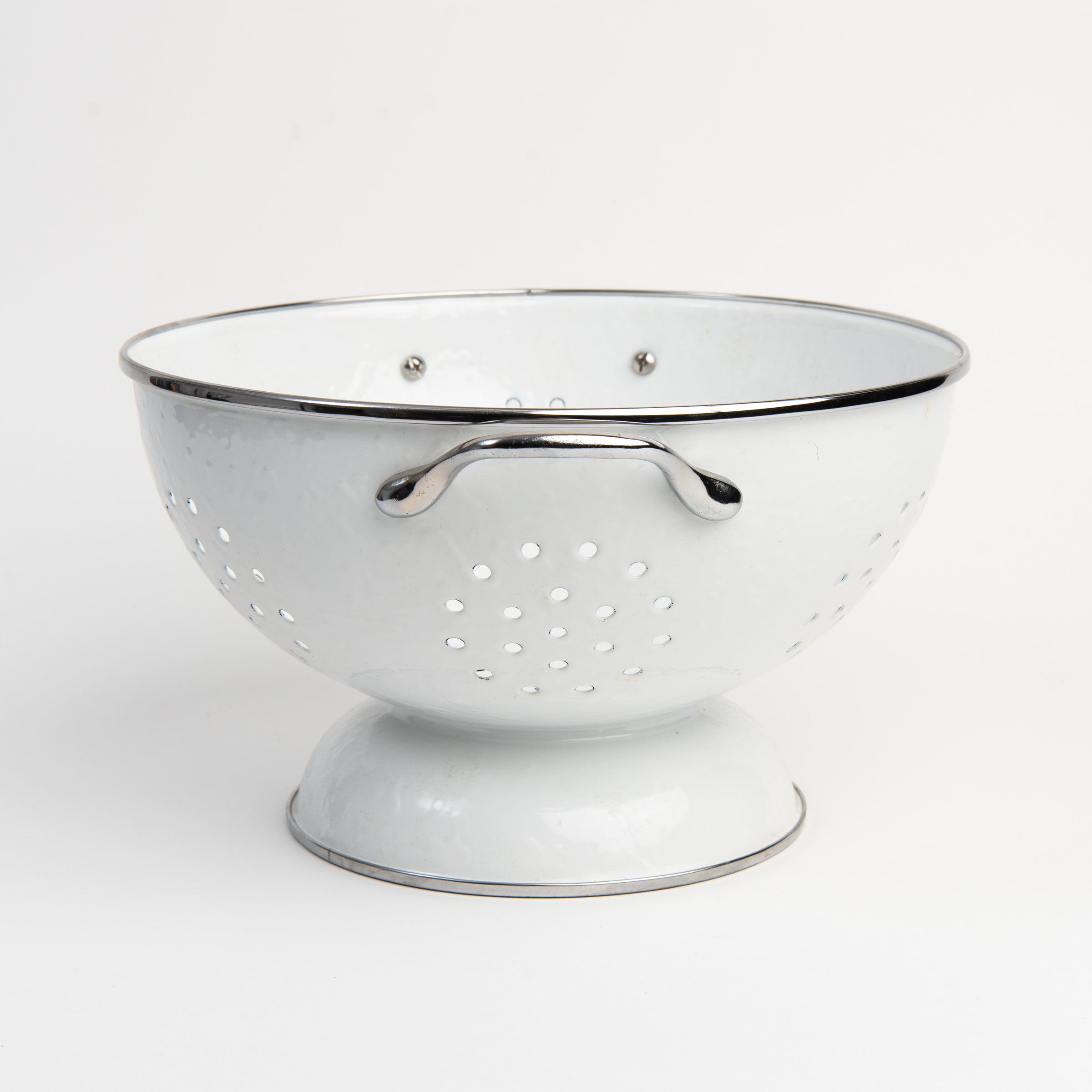 Medium White Enamelware Colander on a white background at Addison West