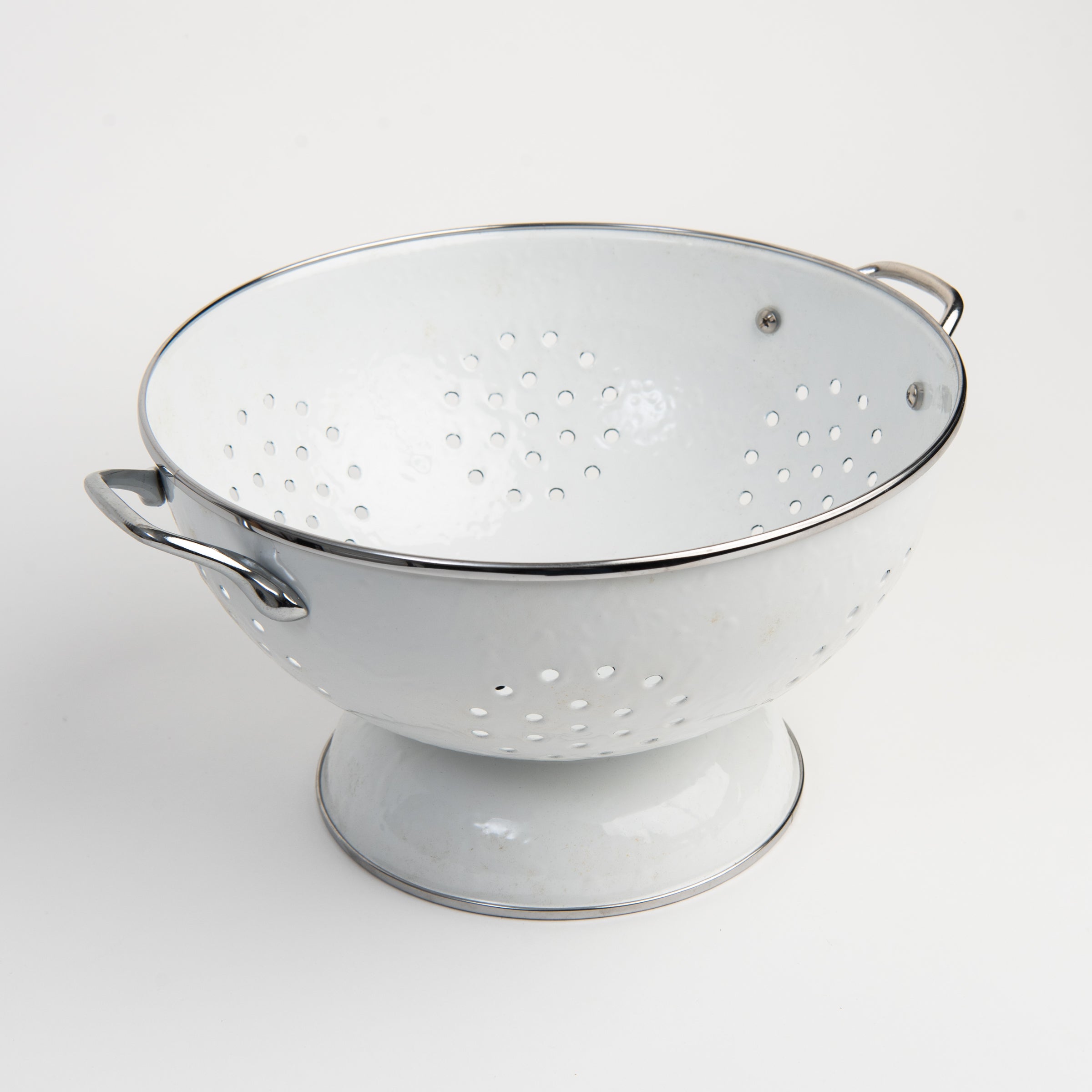 Medium White Enamelware Colander on a white background at Addison West