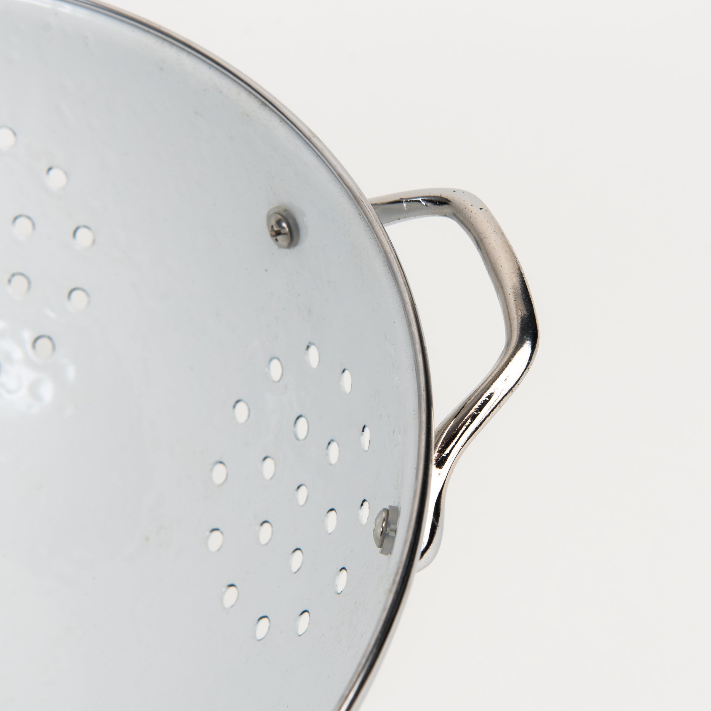 Medium White Enamelware Colander on a white background at Addison West