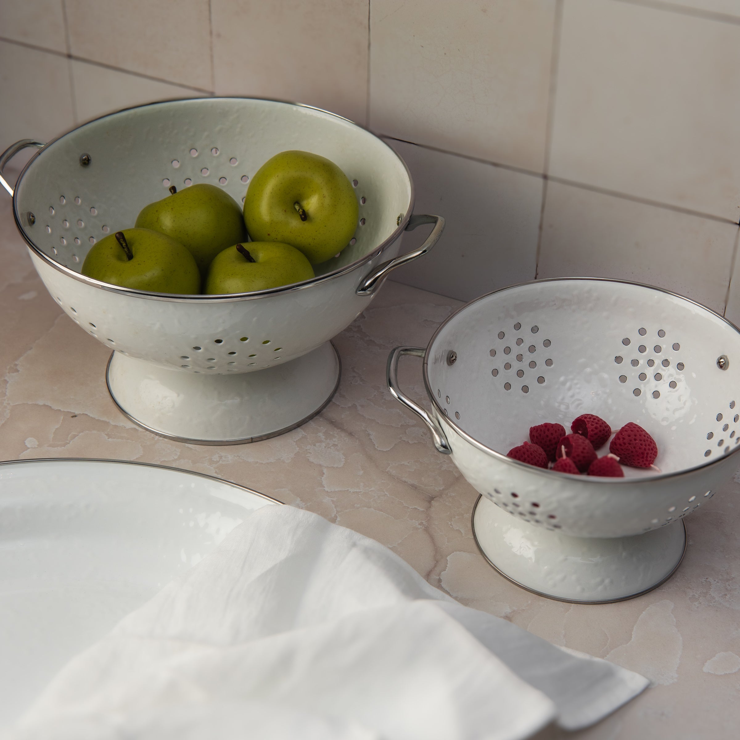 White Enamelware Colander on a table at Addison West