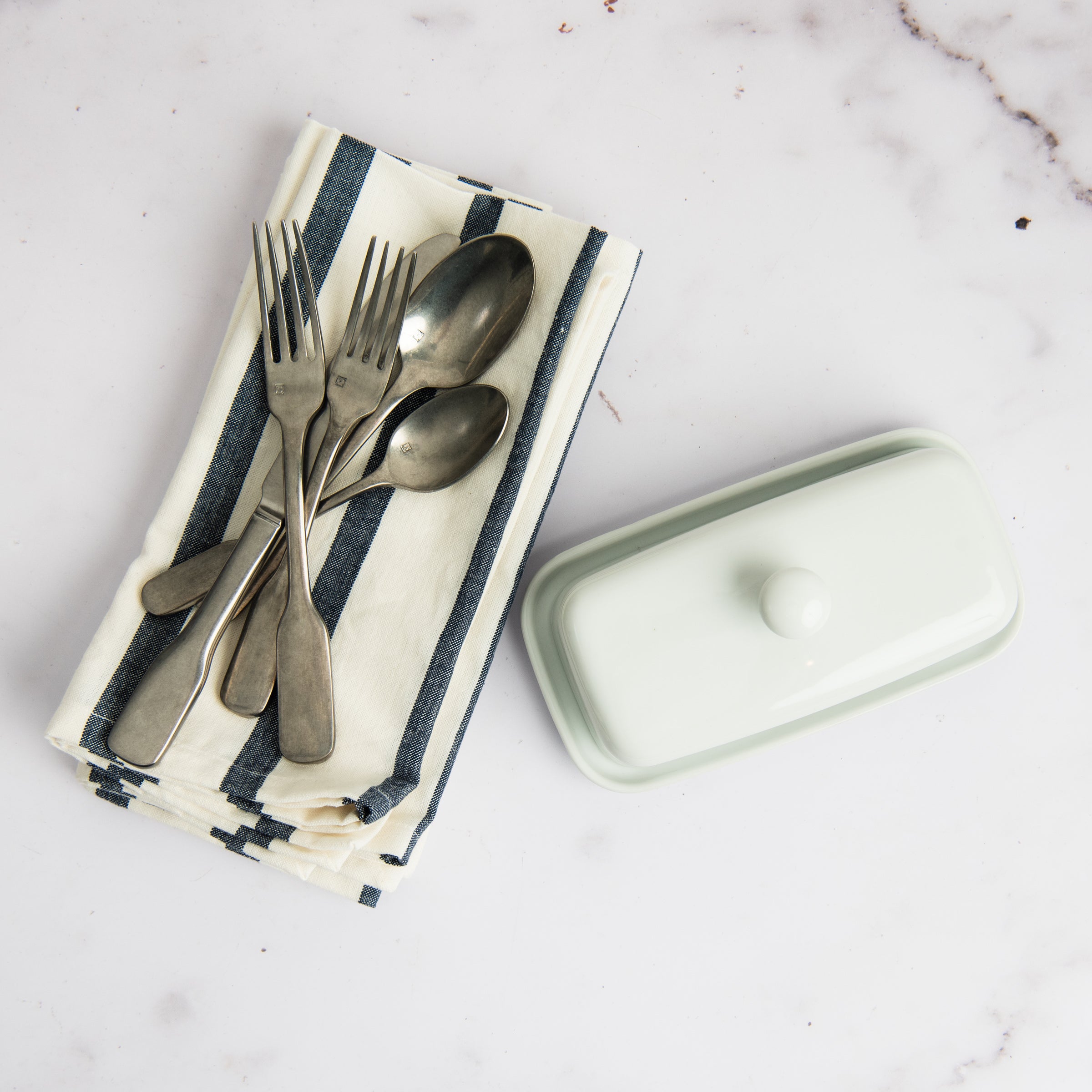 Denim Blue Striped Napkins, Set of 4 on a table at Addison West