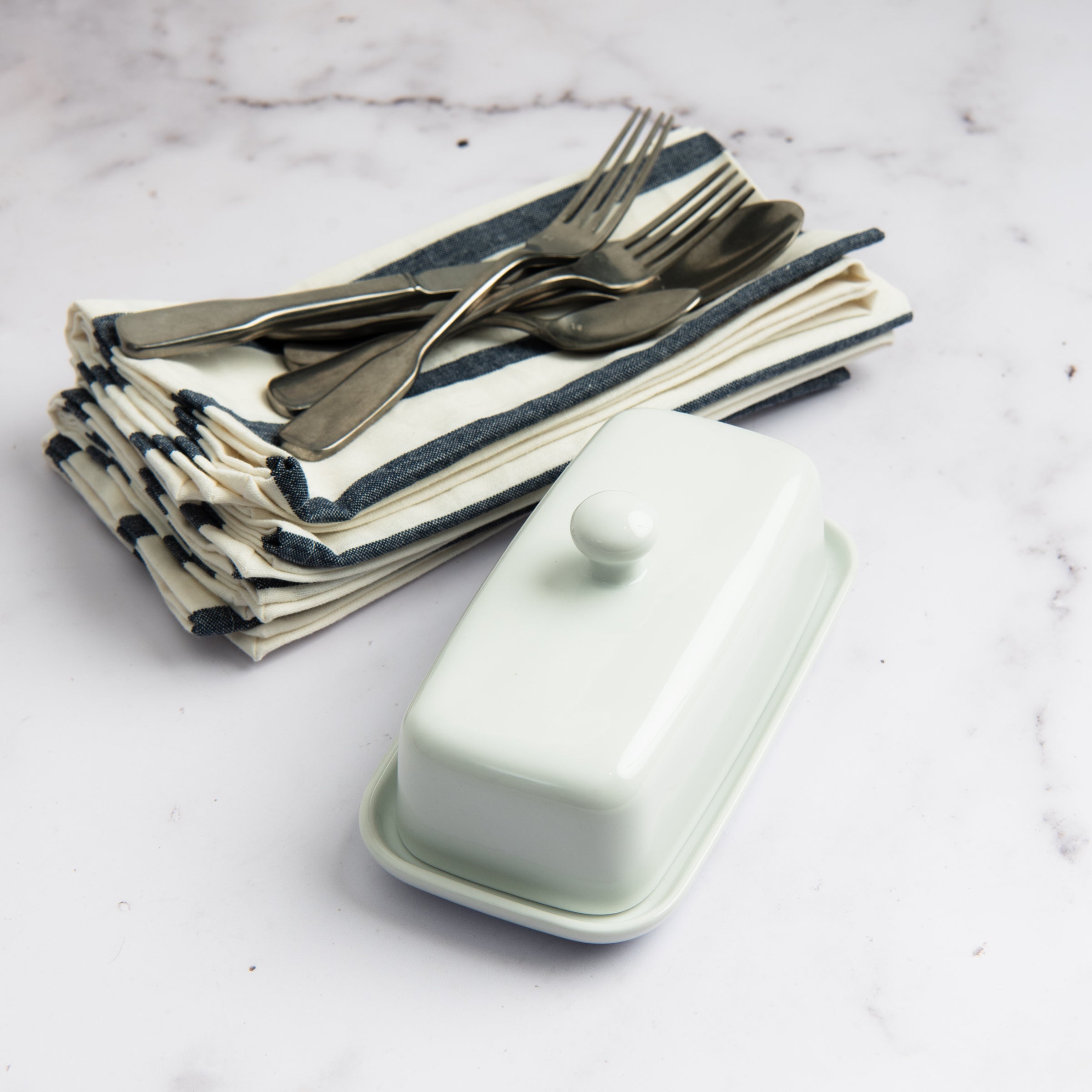 Denim Blue Striped Napkins, Set of 4 on a table at Addison West