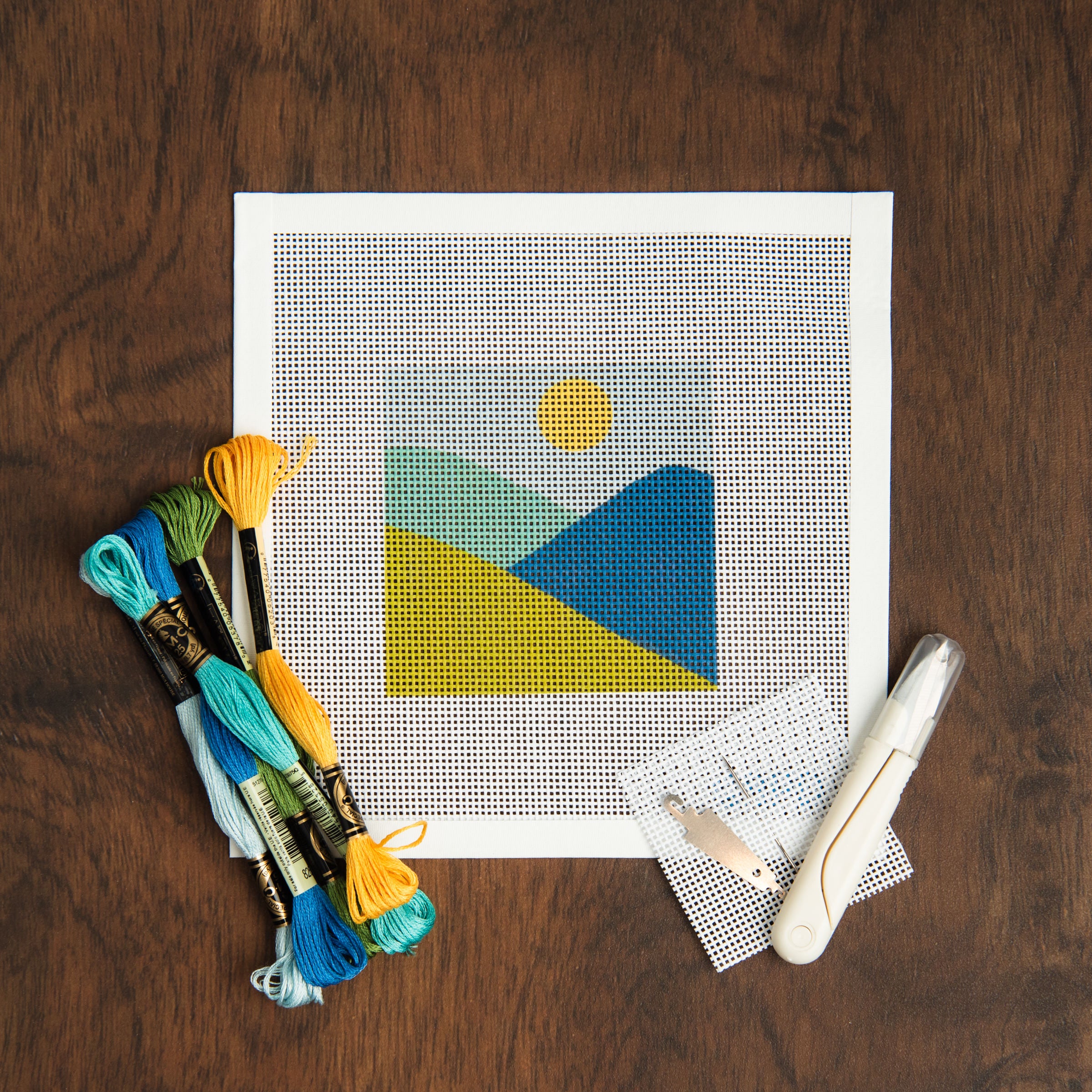 Mountains Needlepoint Kit on a table at Addison West