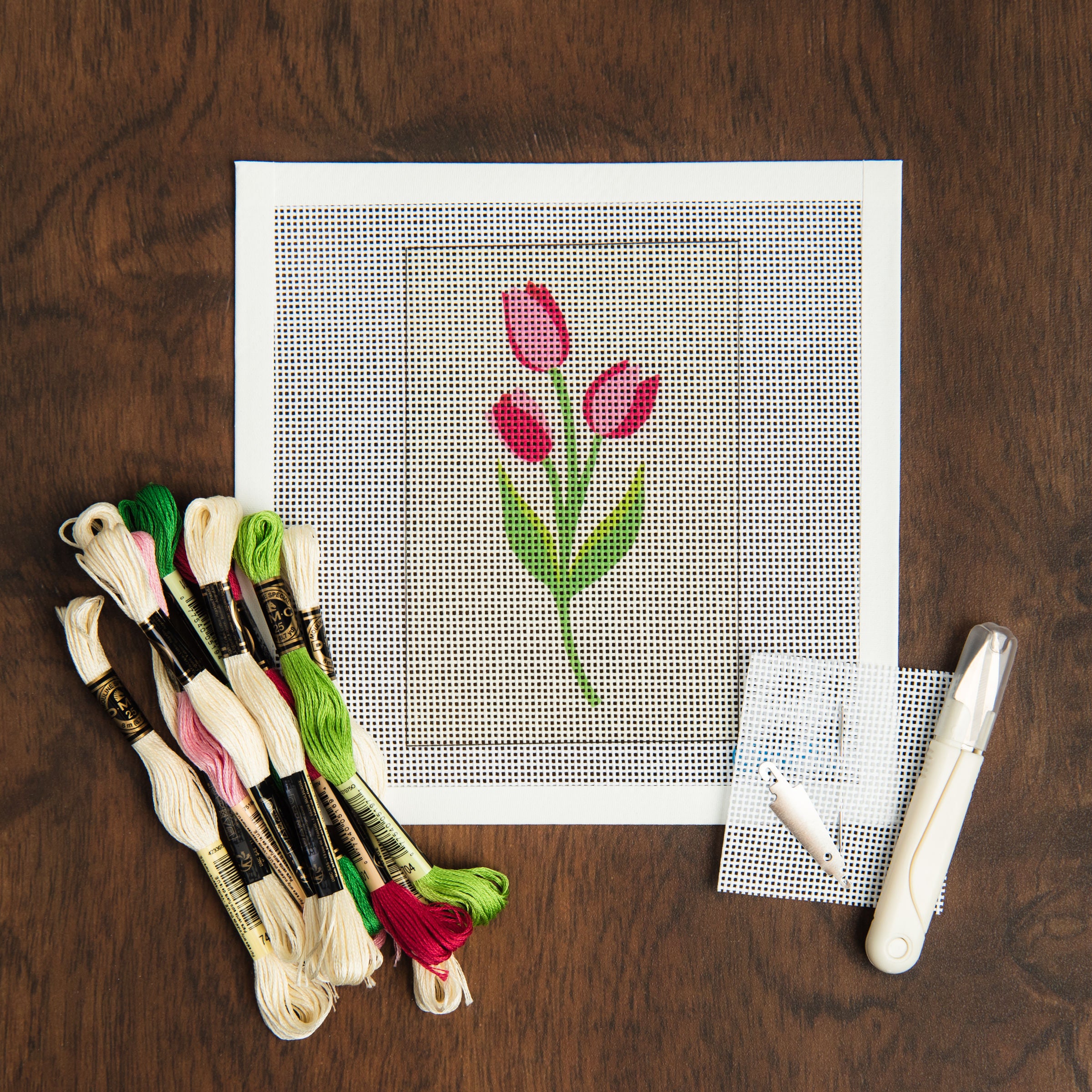 Tulips Needlepoint Kit on a table at Addison West