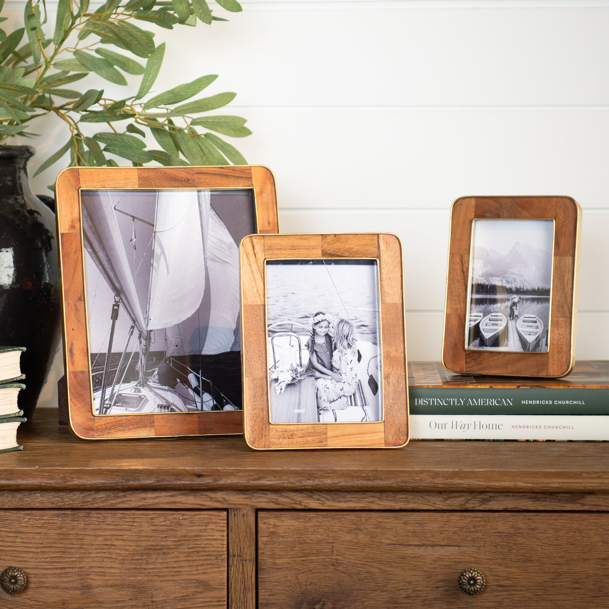 The Classic Wood and Brass Picture Frame on a table at Addison West