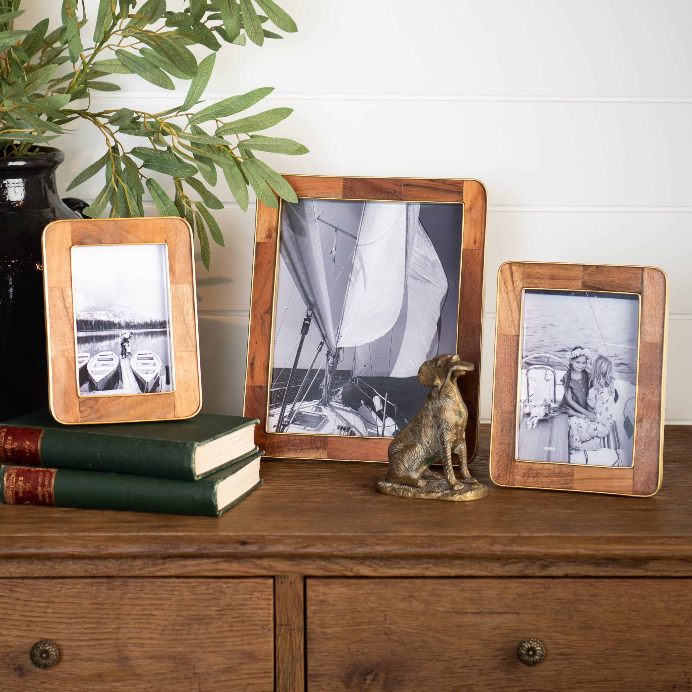 The Classic Wood and Brass Picture Frame on a table at Addison West