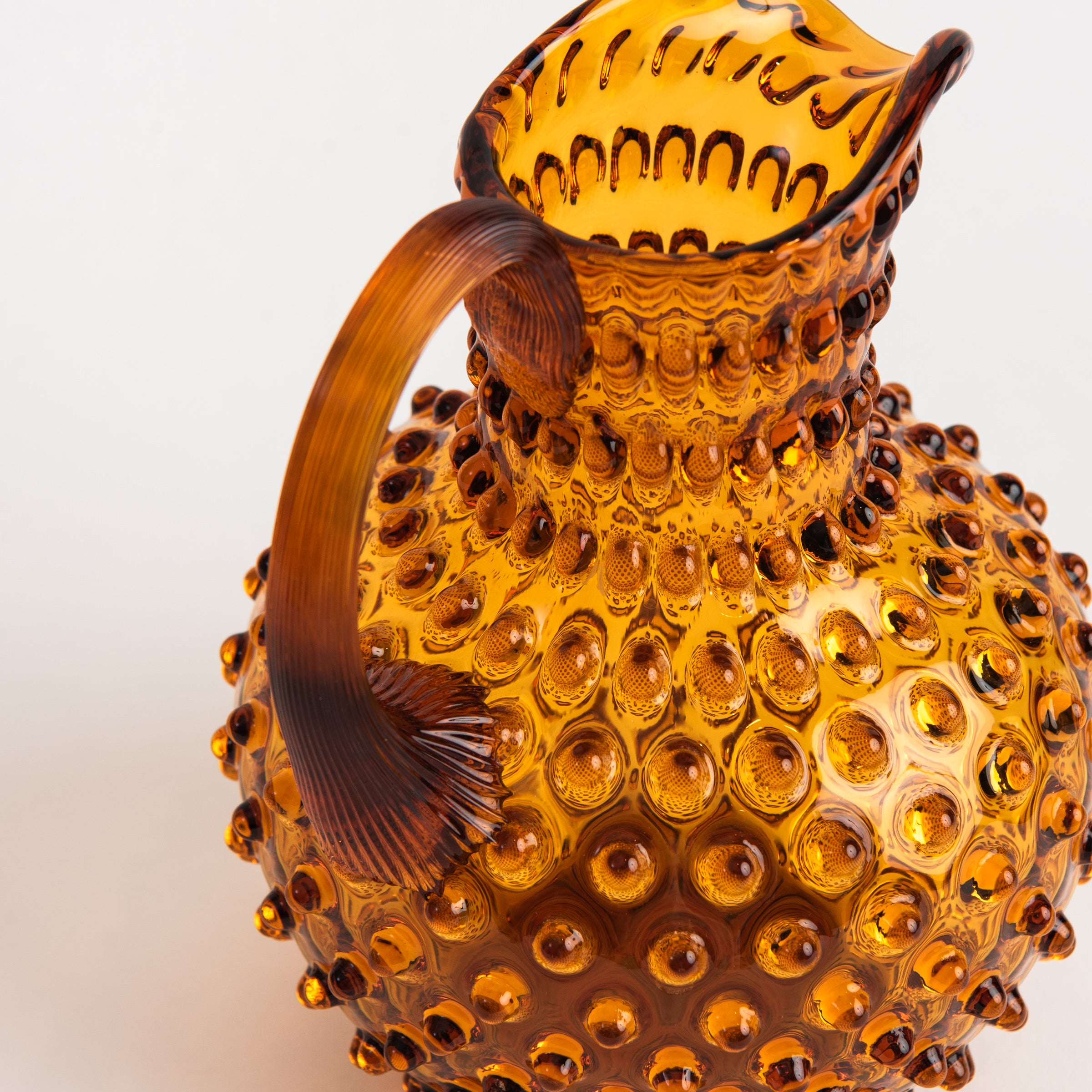 Hobnail Glass Pitcher in Saffron Light on a white background at Addison West
