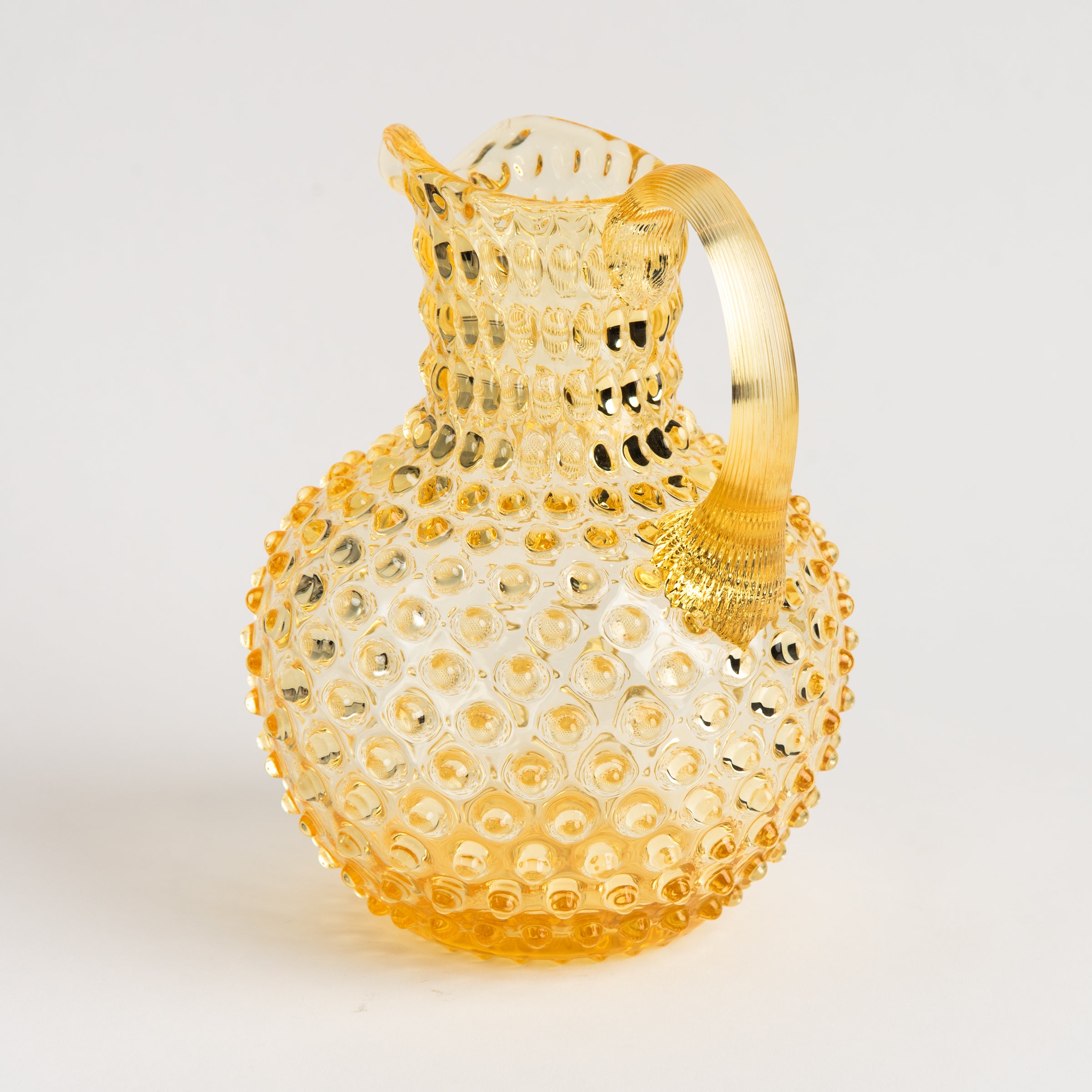 Hobnail Glass Pitcher, Limoncello on a white background at Addison West