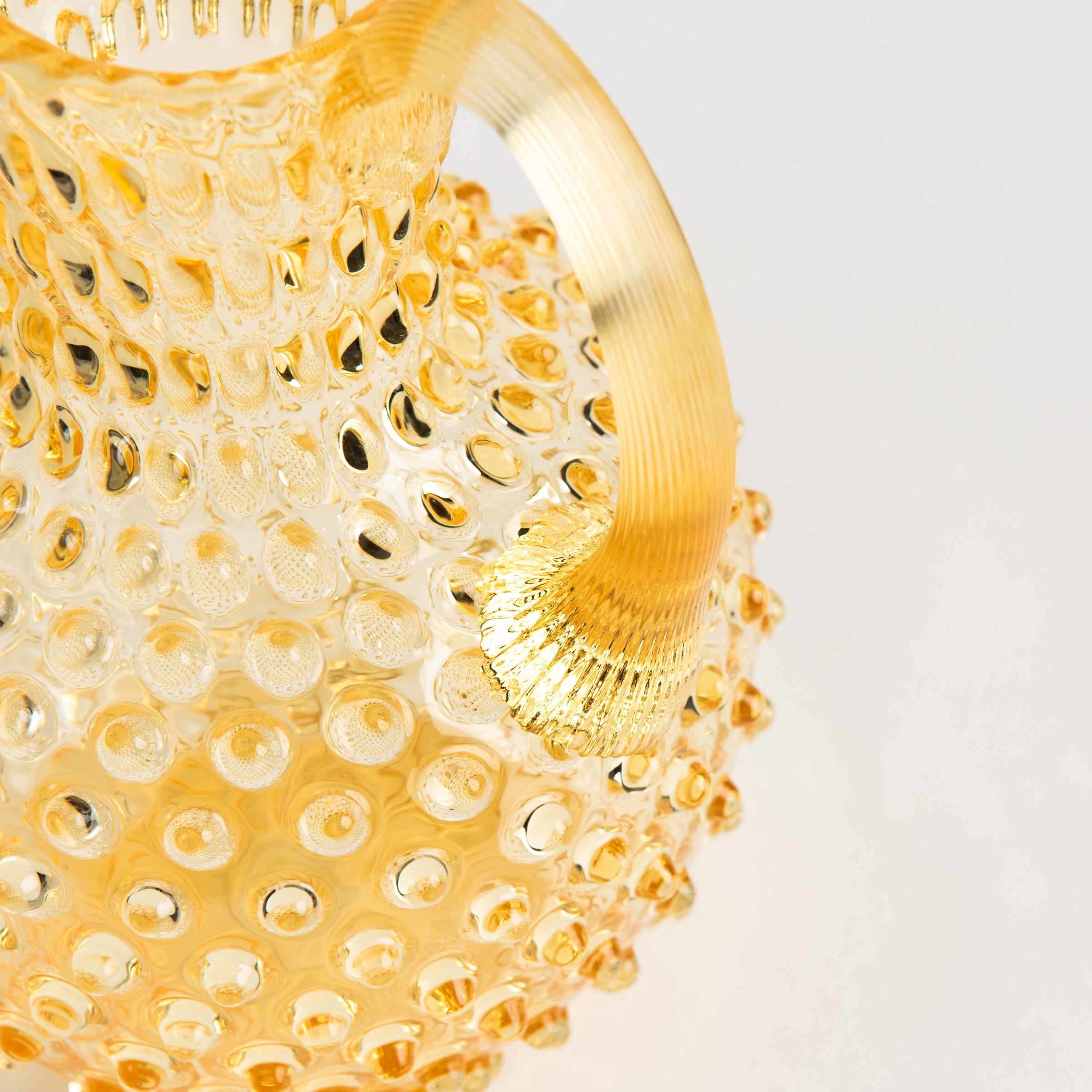 Hobnail Glass Pitcher, Limoncello on a white background at Addison West
