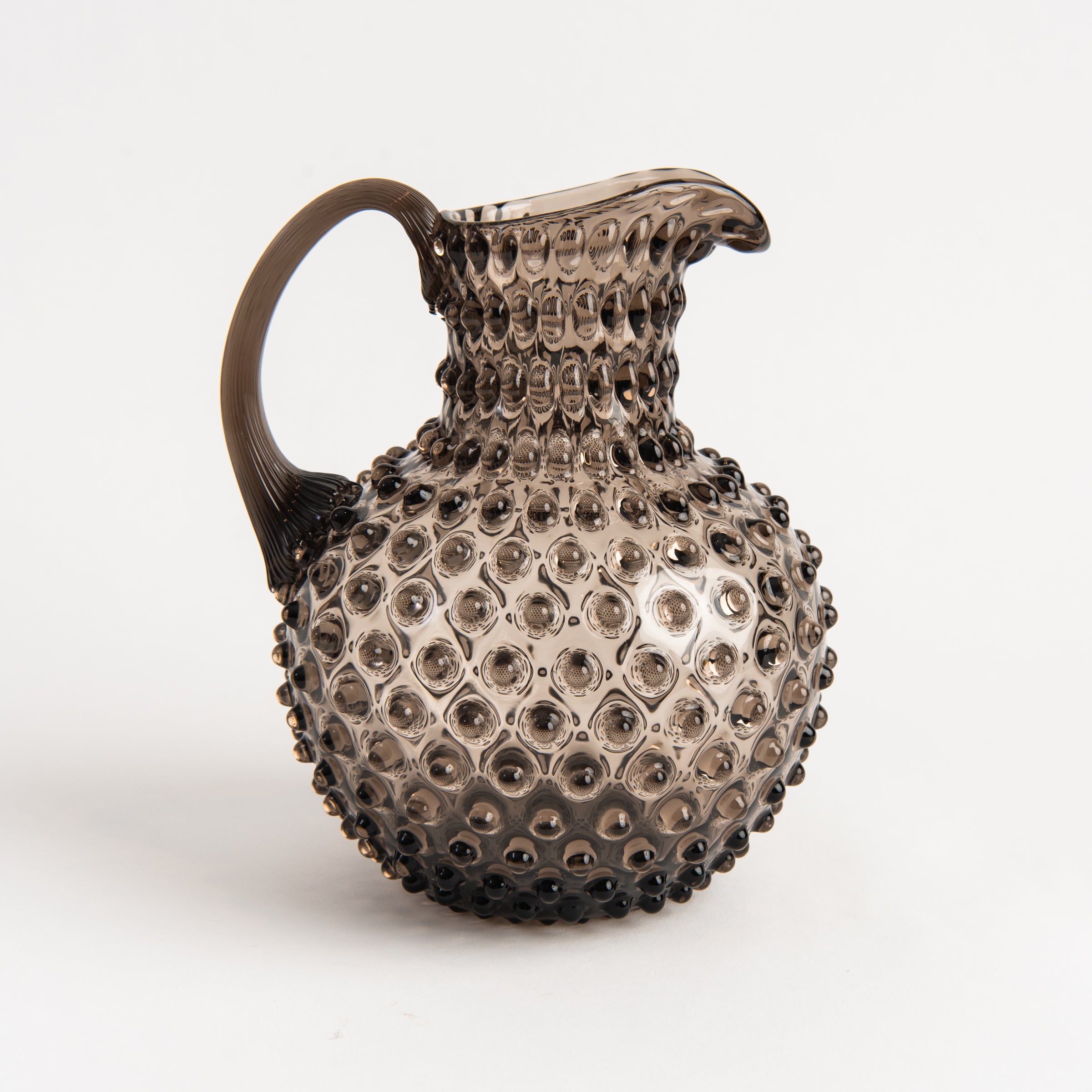 Hobnail Glass Pitcher in Smoky Amaro on a white background at Addison West