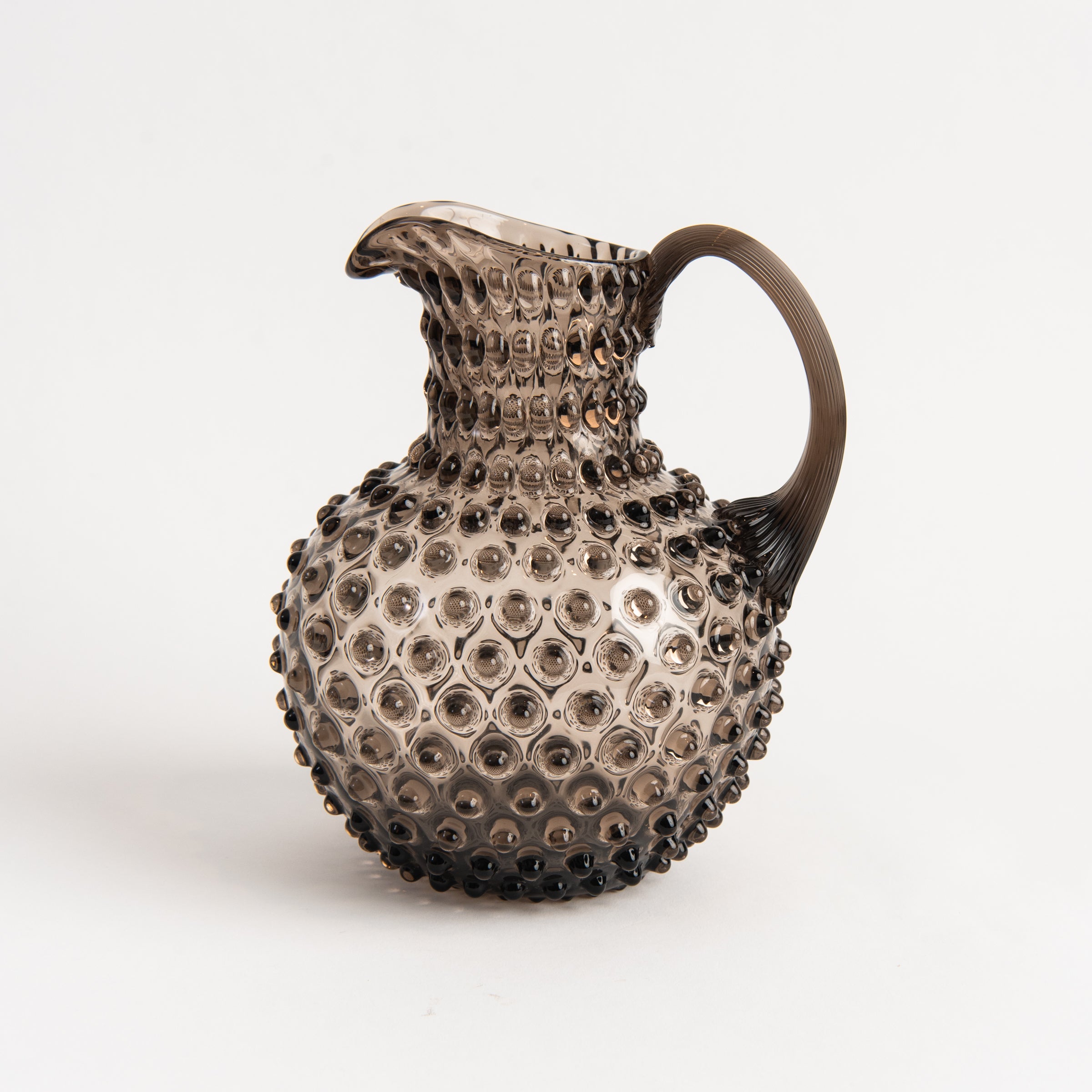 Hobnail Glass Pitcher in Smoky Amaro on a white background at Addison West