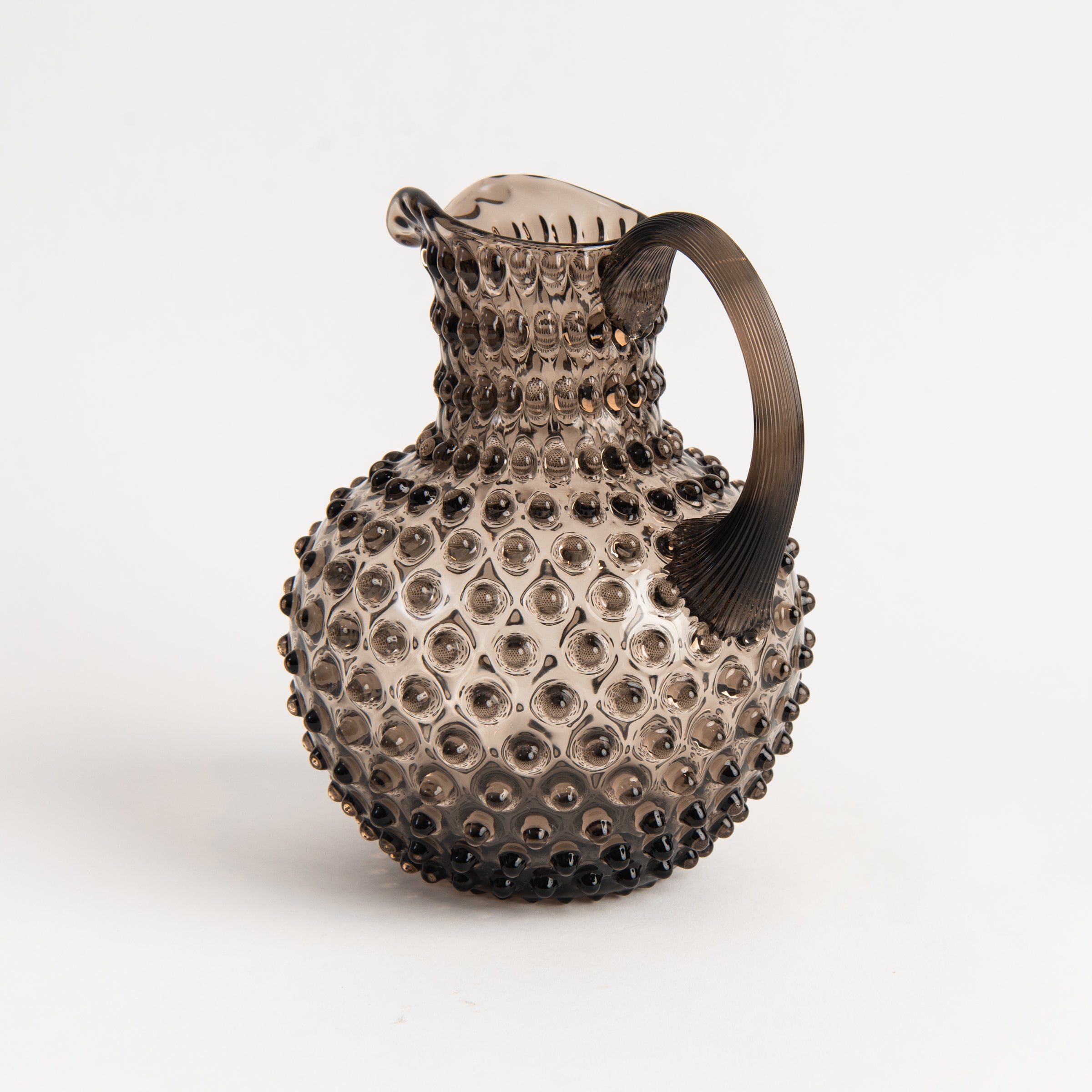 Hobnail Glass Pitcher in Smoky Amaro on a white background at Addison West