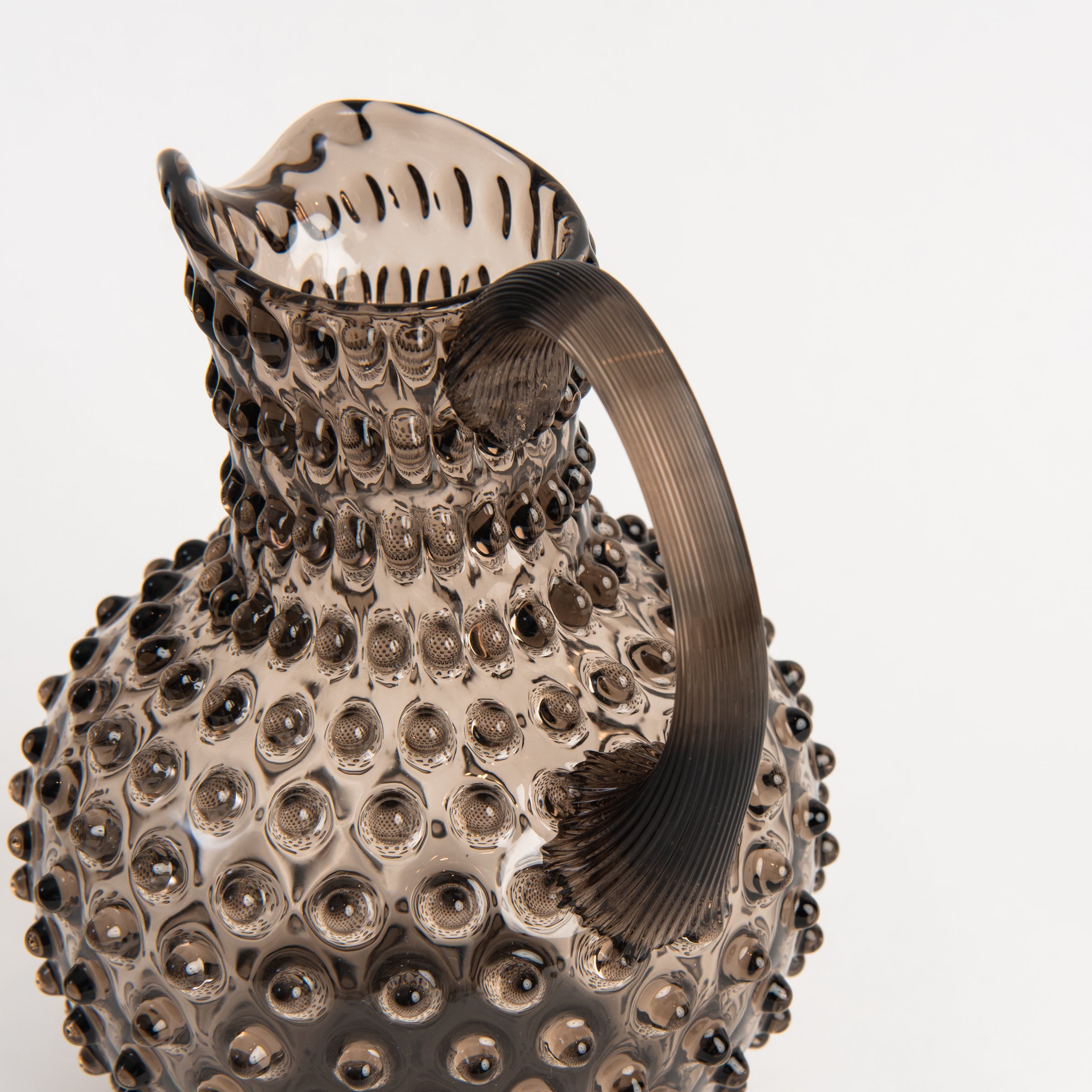 Hobnail Glass Pitcher in Smoky Amaro on a white background at Addison West