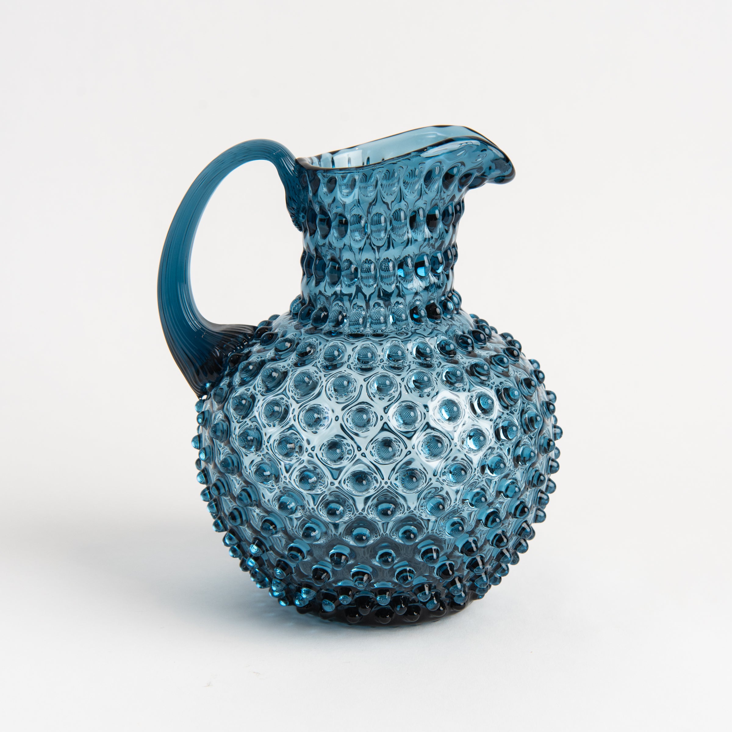 Hobnail Glass Pitcher in Midnight Blue on a white background at Addison West