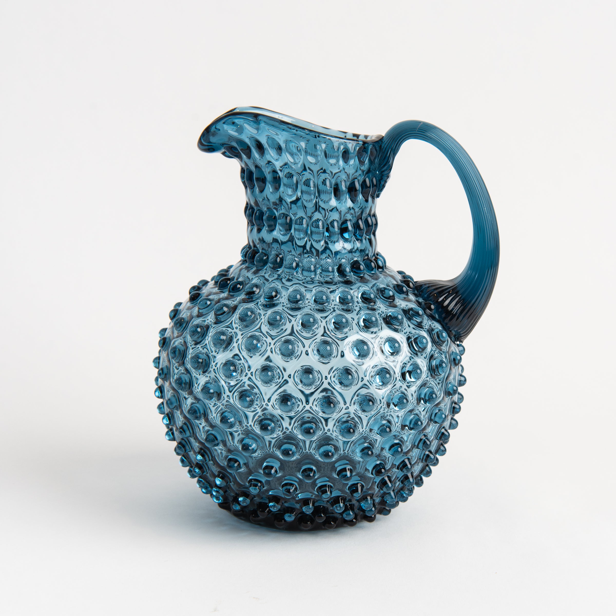 Hobnail Glass Pitcher in Midnight Blue on a white background at Addison West