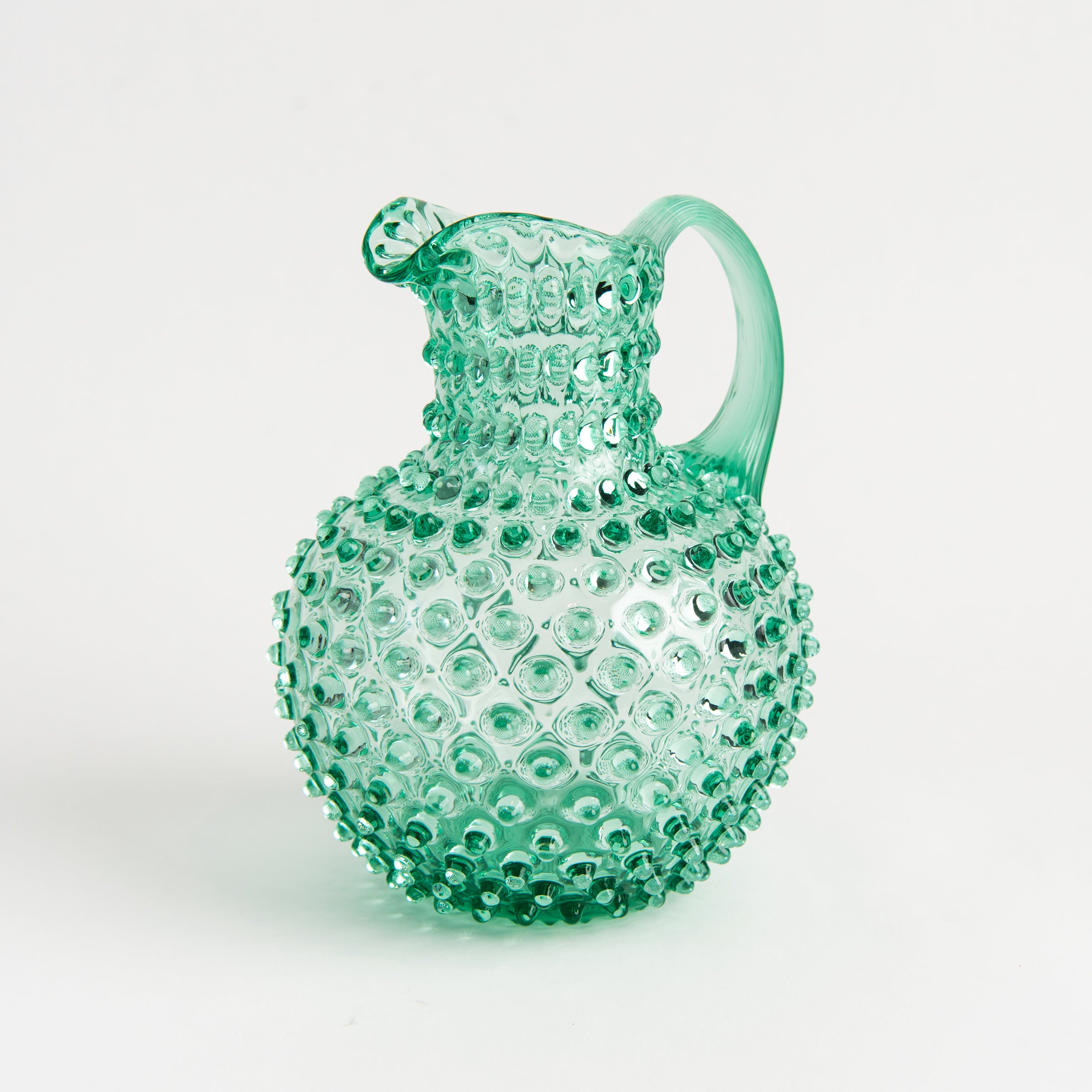 Hobnail Glass Pitcher in Capri Sea on a white background at Addison West