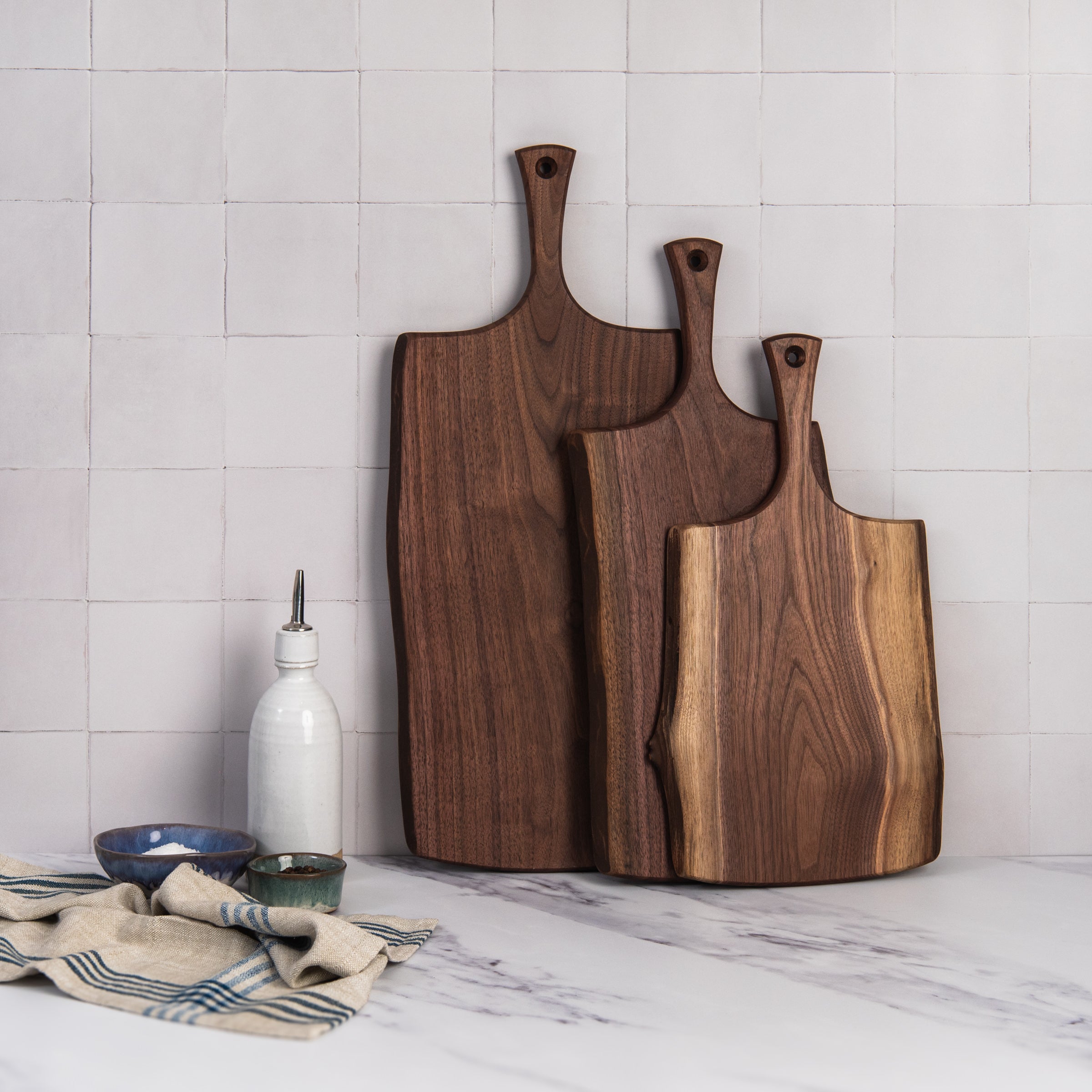 18" Black Walnut Serving Board on a kitchen counter at Addison West