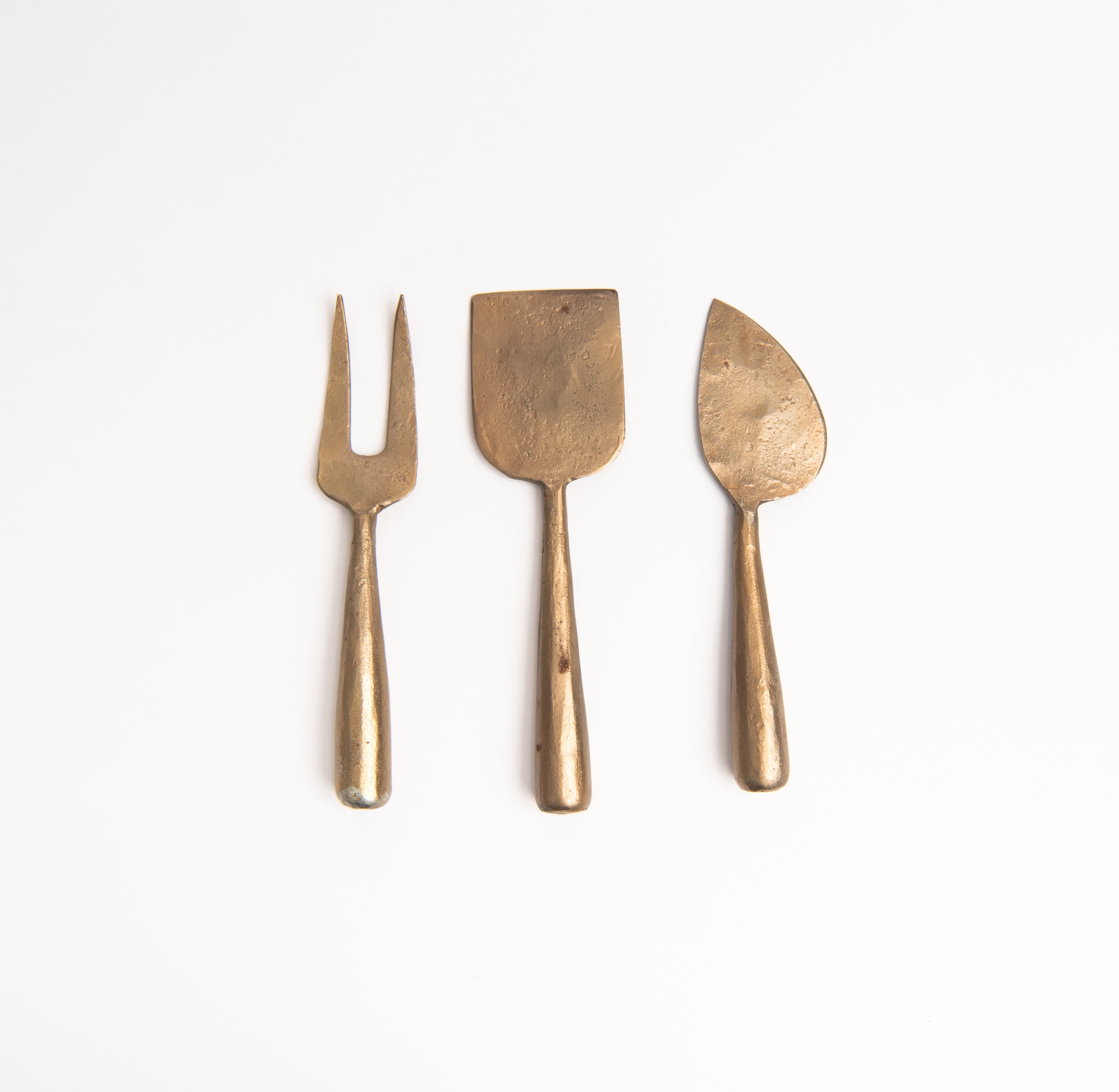 Hand Forged Metal Cheese Set on a white background at Addison West