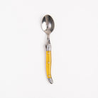 Laguiole Rainbow Spoon yello on a white background at Addison West