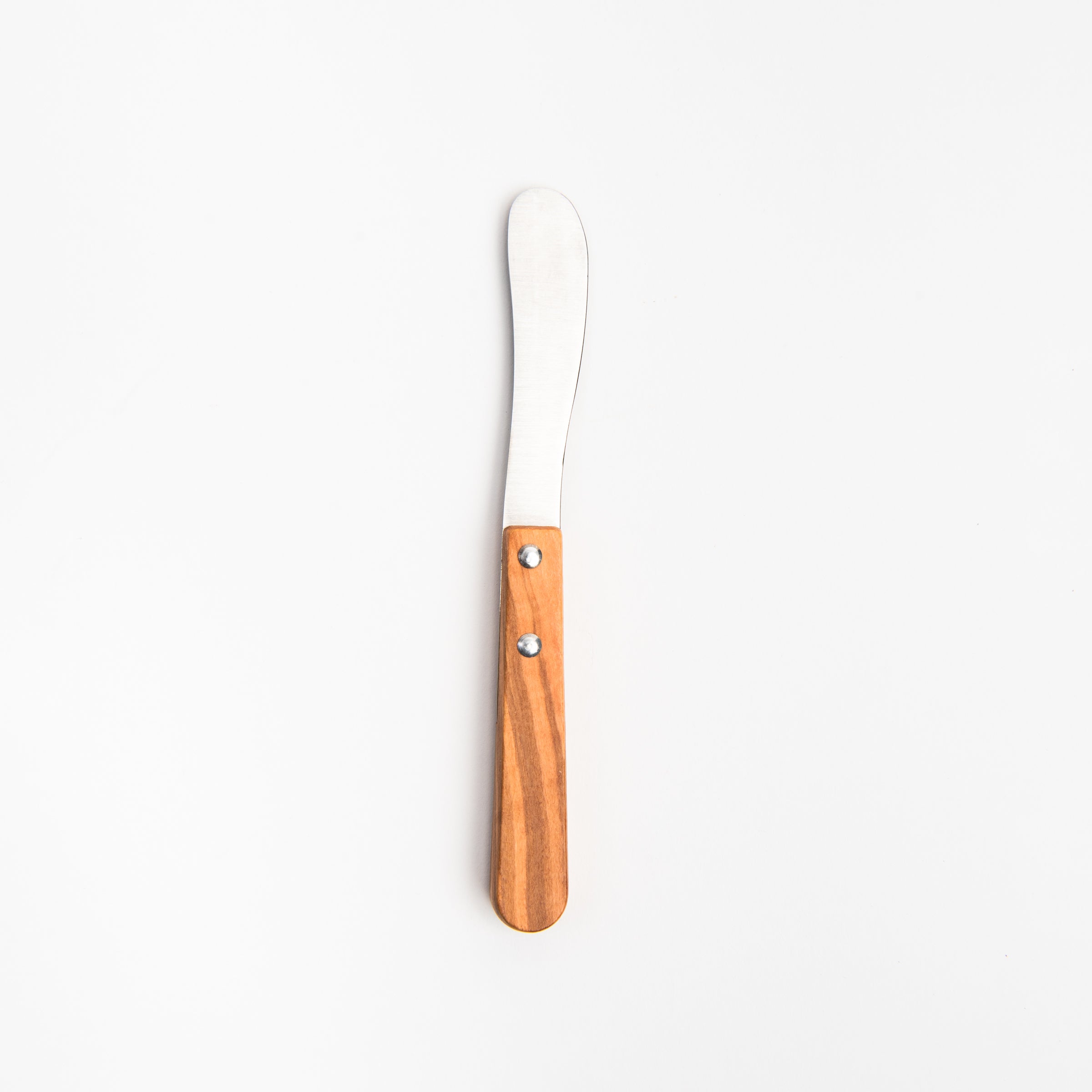 The Olive Wood Butter Knife on a white background at Addison West