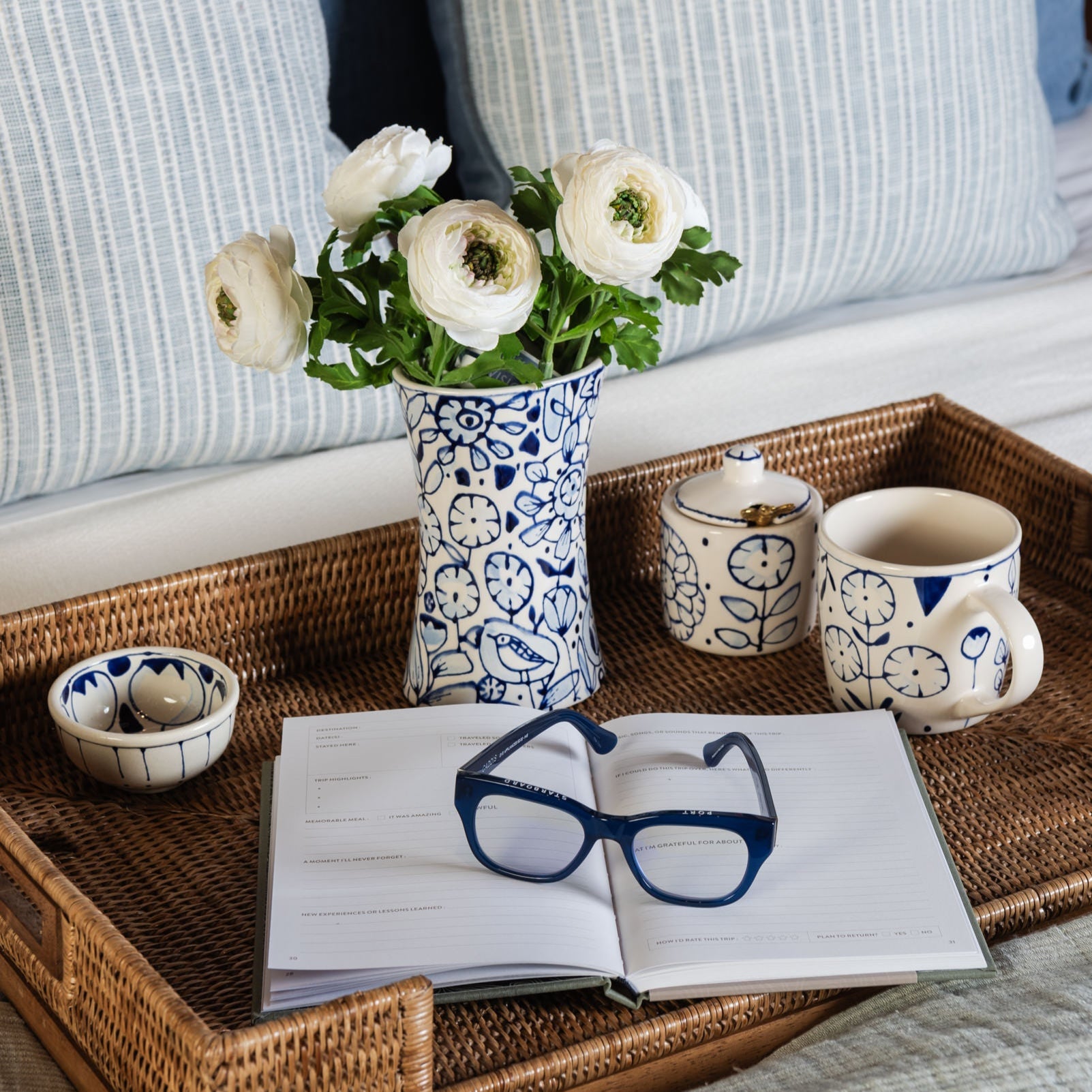 Stephanie Verdun Sauce Cups on a tray on a bed at Addison West
