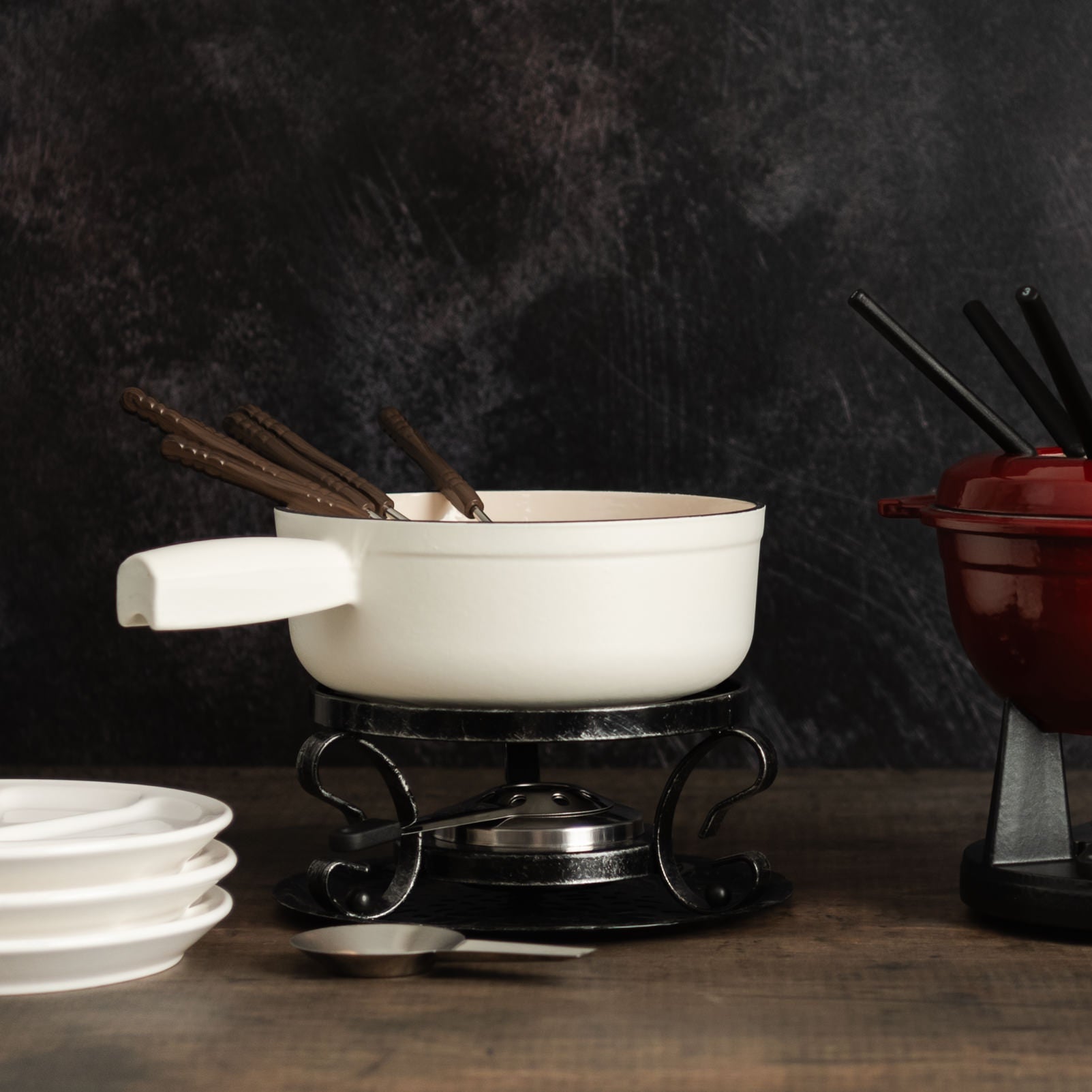 Vintage Fondue Plates and White on a wood table at Addison West