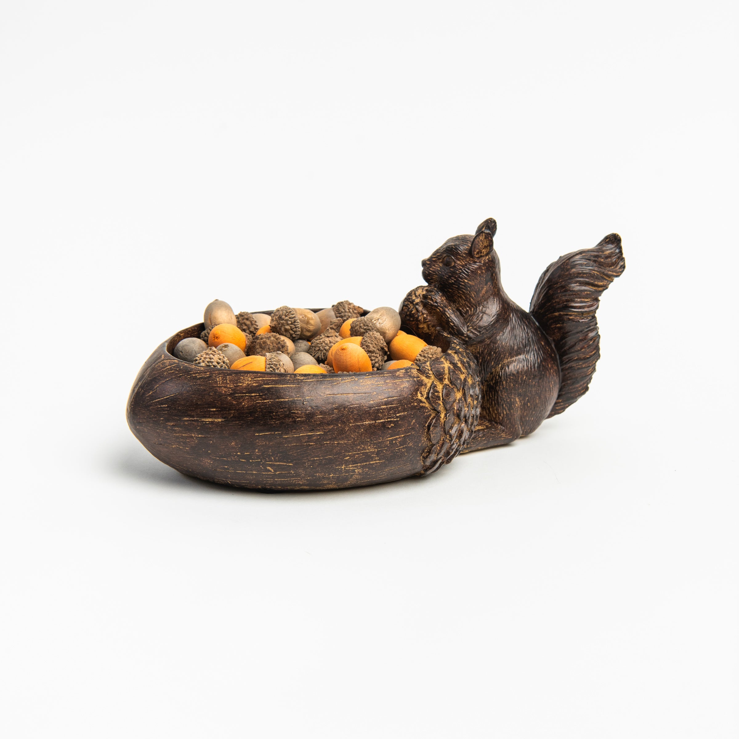 Rustic brown resin Squirrel Tray with orange and brown acorns on a white background