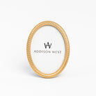 Laurel Wreath Oval Picture Frame on a white background at Addison West