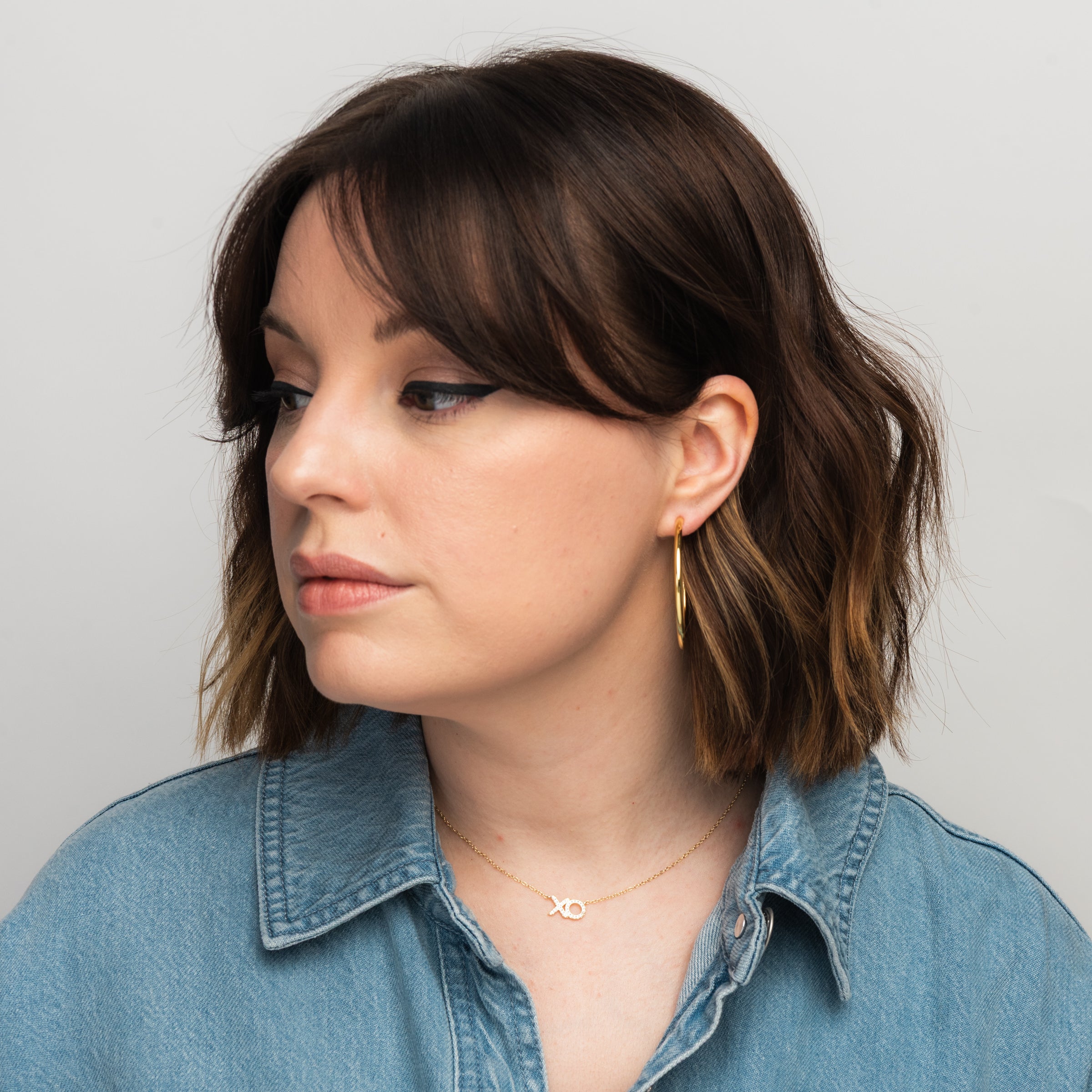 Elli Parr Classic Gold Hoops on a model at Addison West